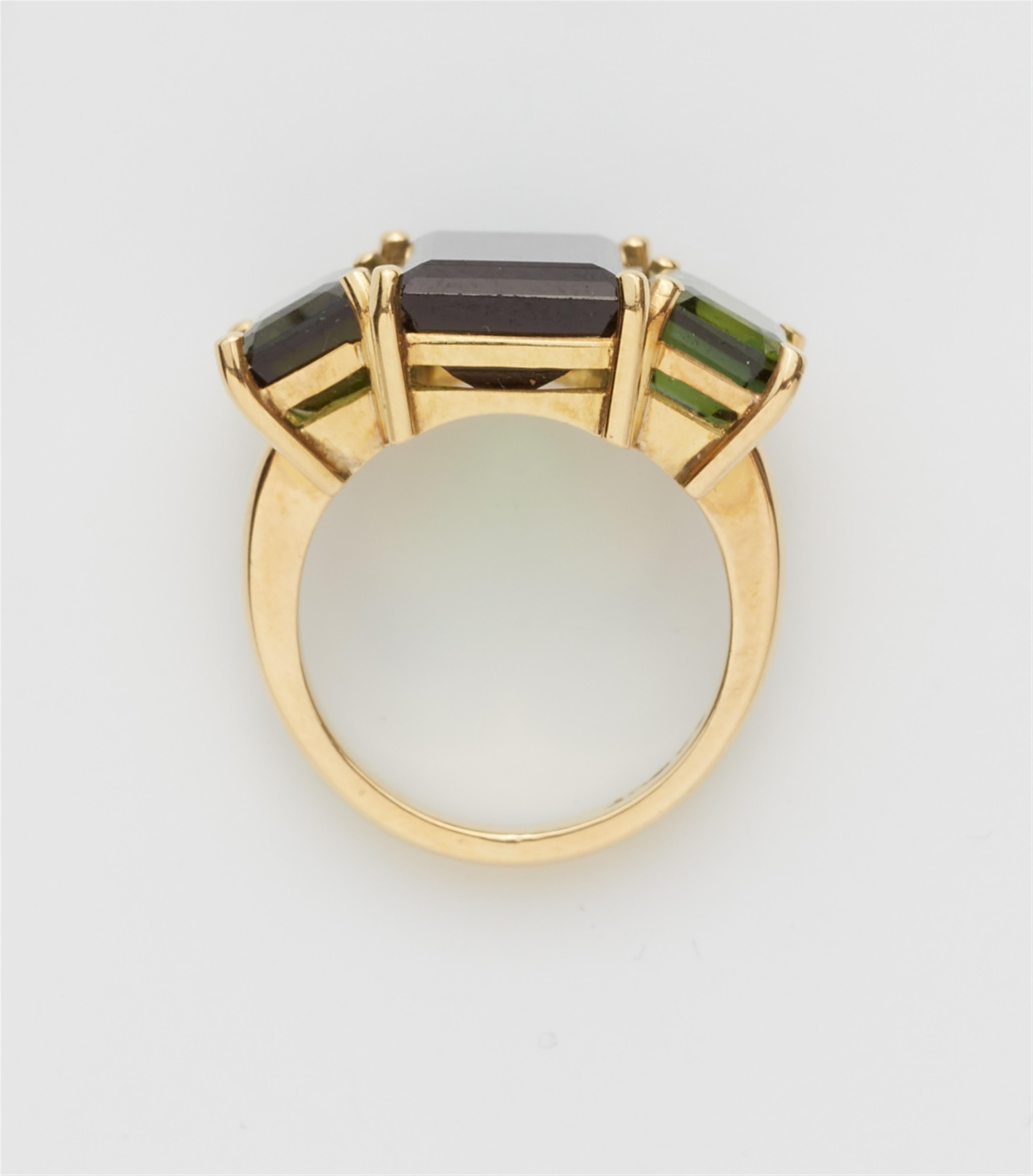 An 18k gold tourmaline three stone ring - image-2