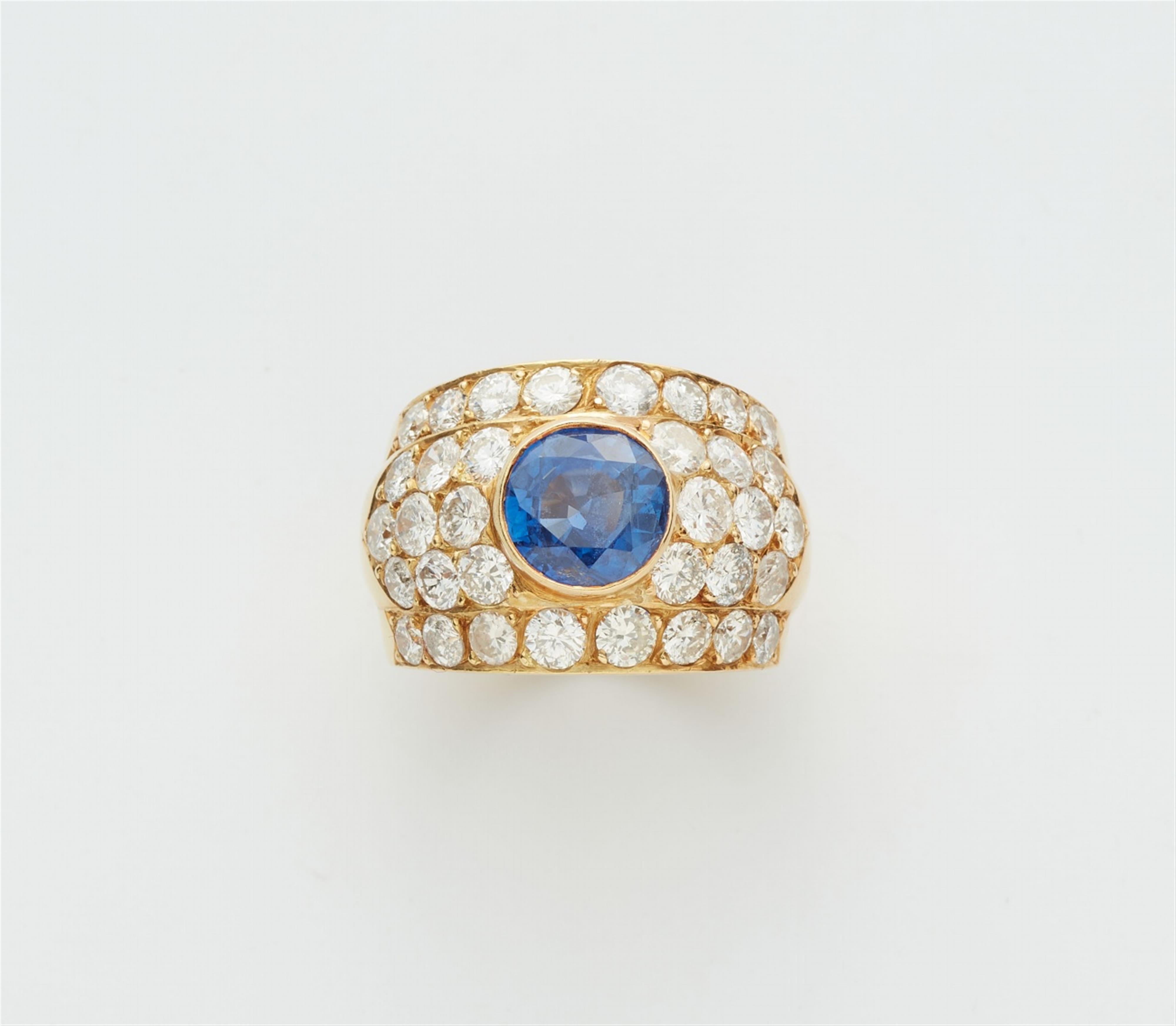 An 18k gold sapphire and diamond ring - image-1