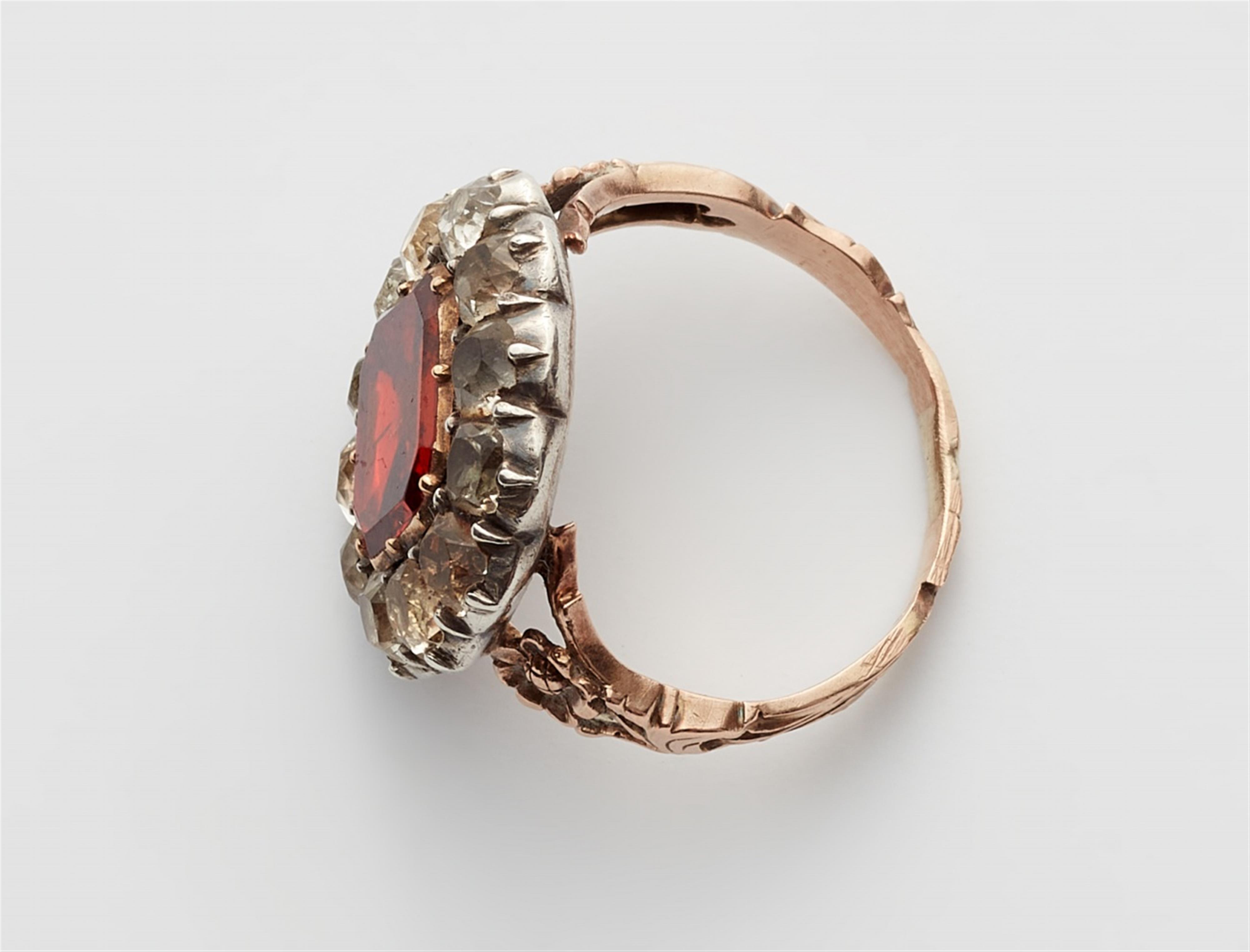 A George III 15k gold garnet ring - image-2