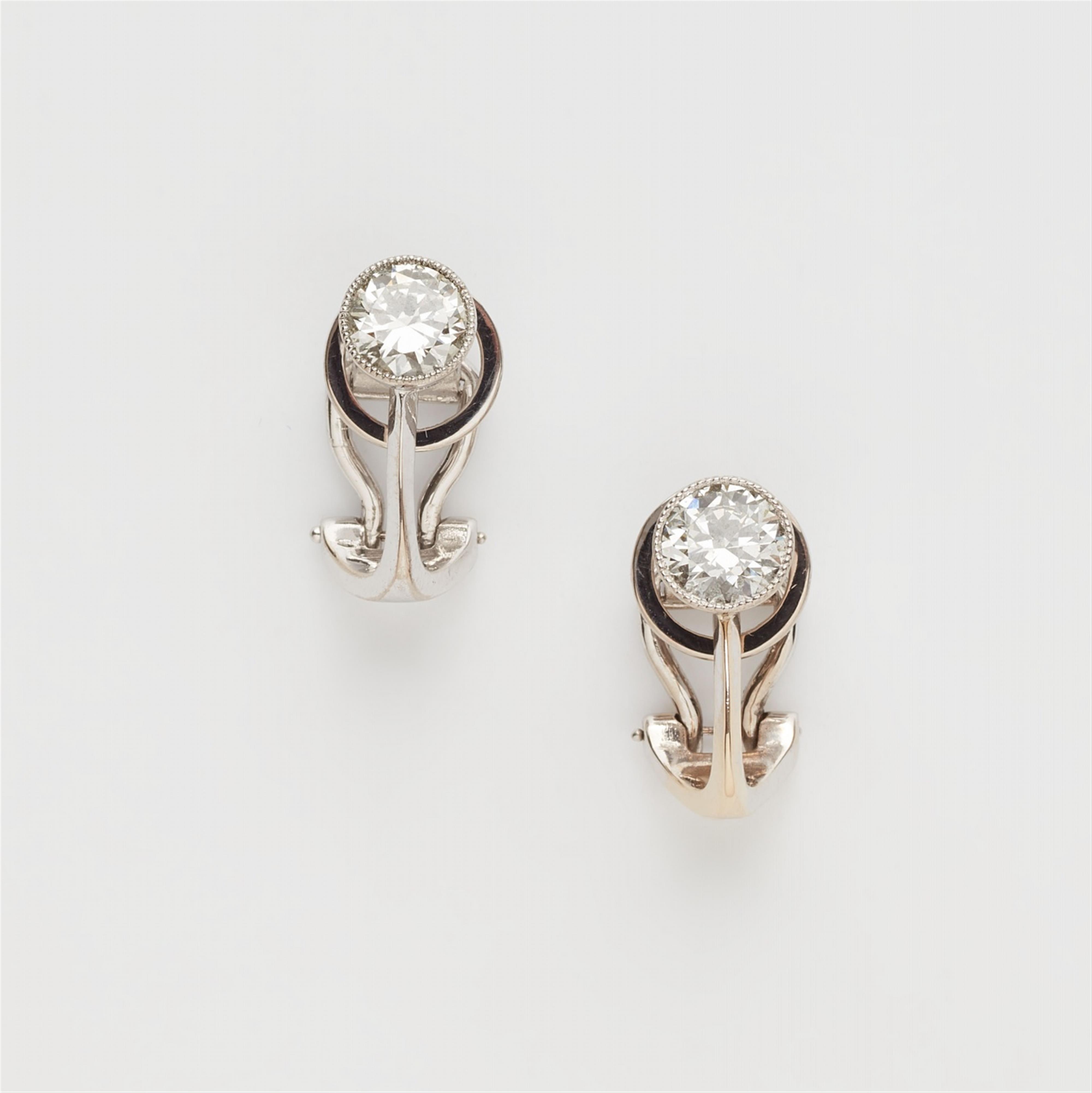 A pair of 18k white gold diamond clip earrings - image-1
