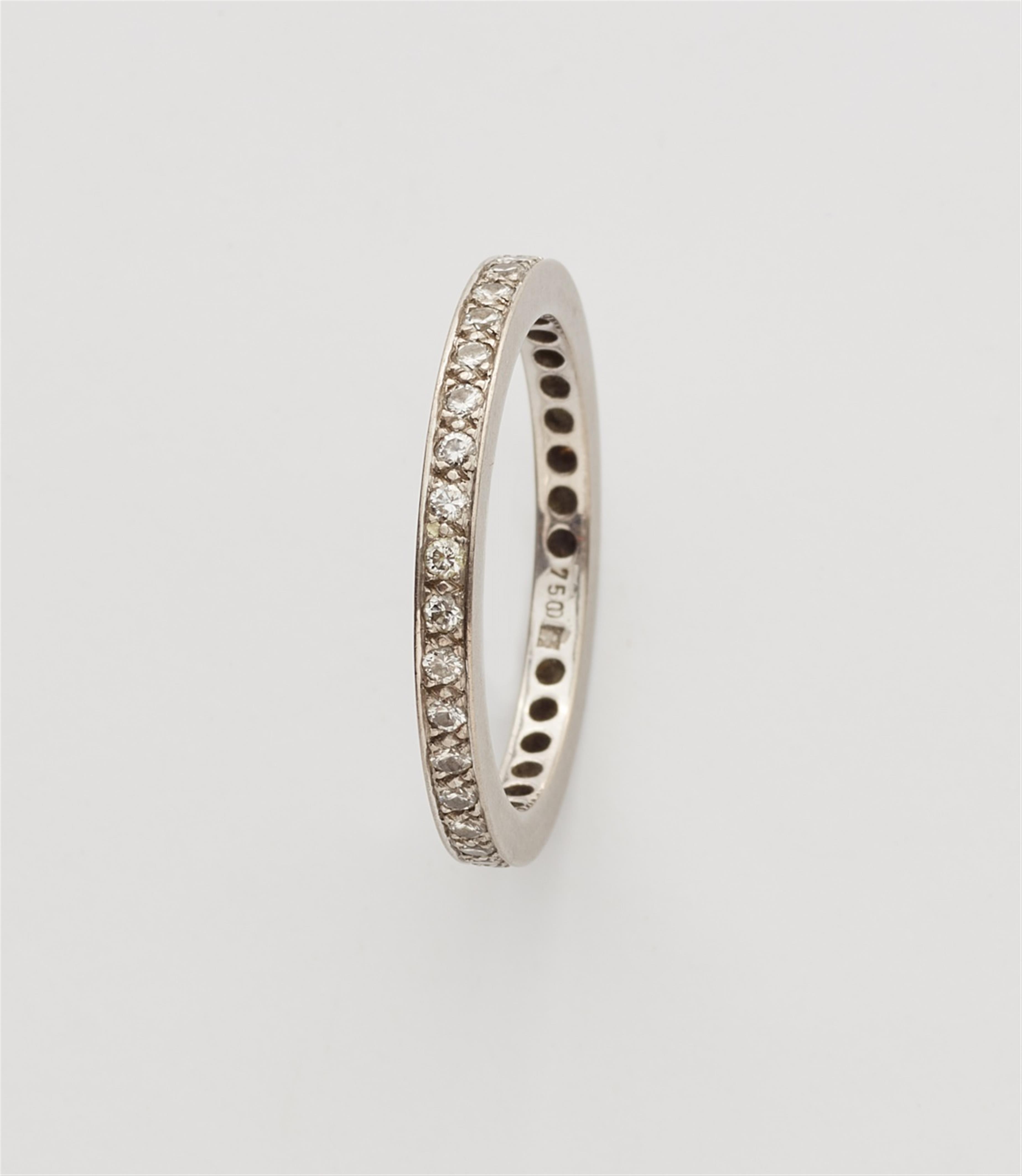 A pair of 18k white gold gentlemen's eternity rings - image-2