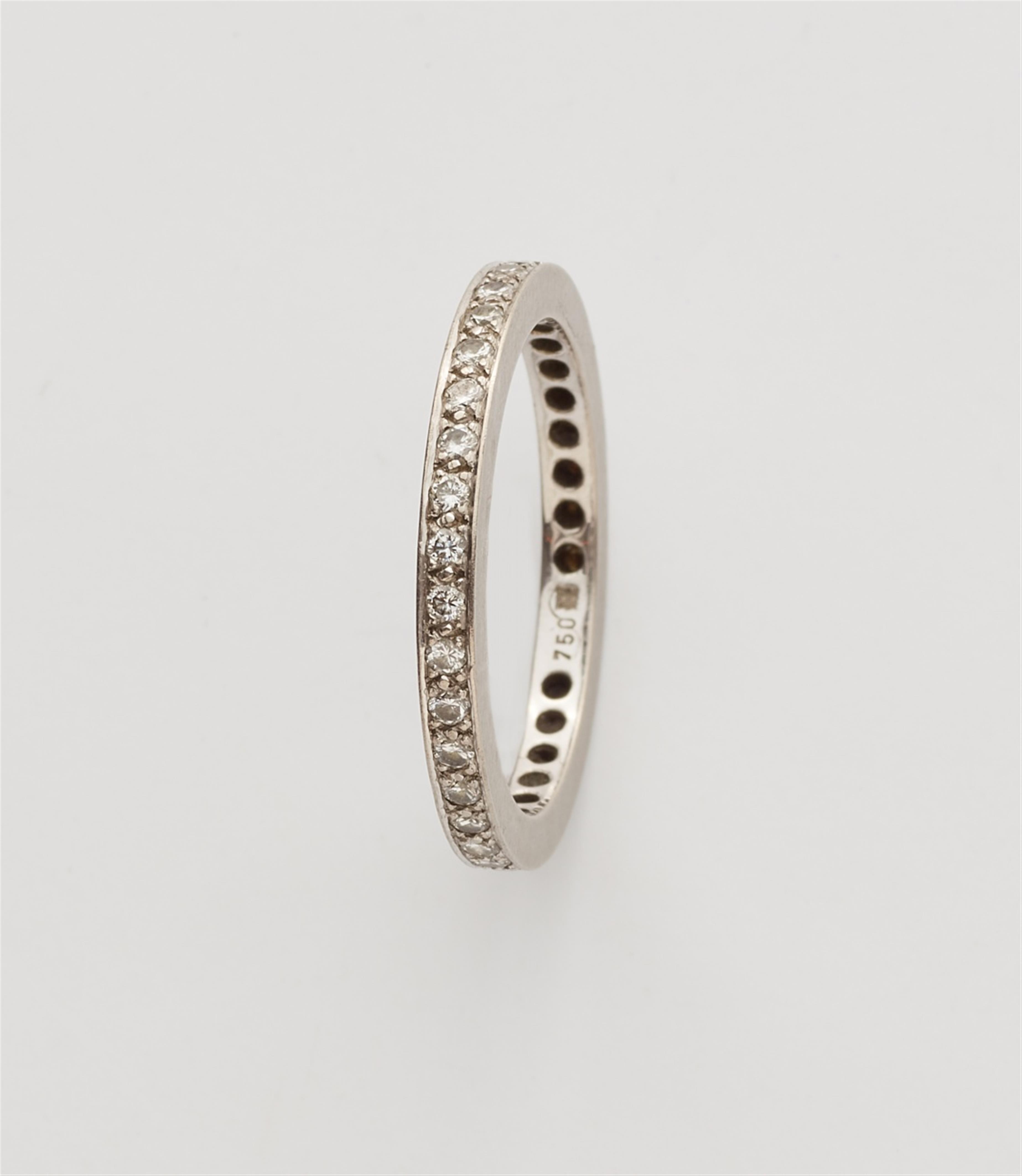A pair of 18k white gold gentlemen's eternity rings - image-3