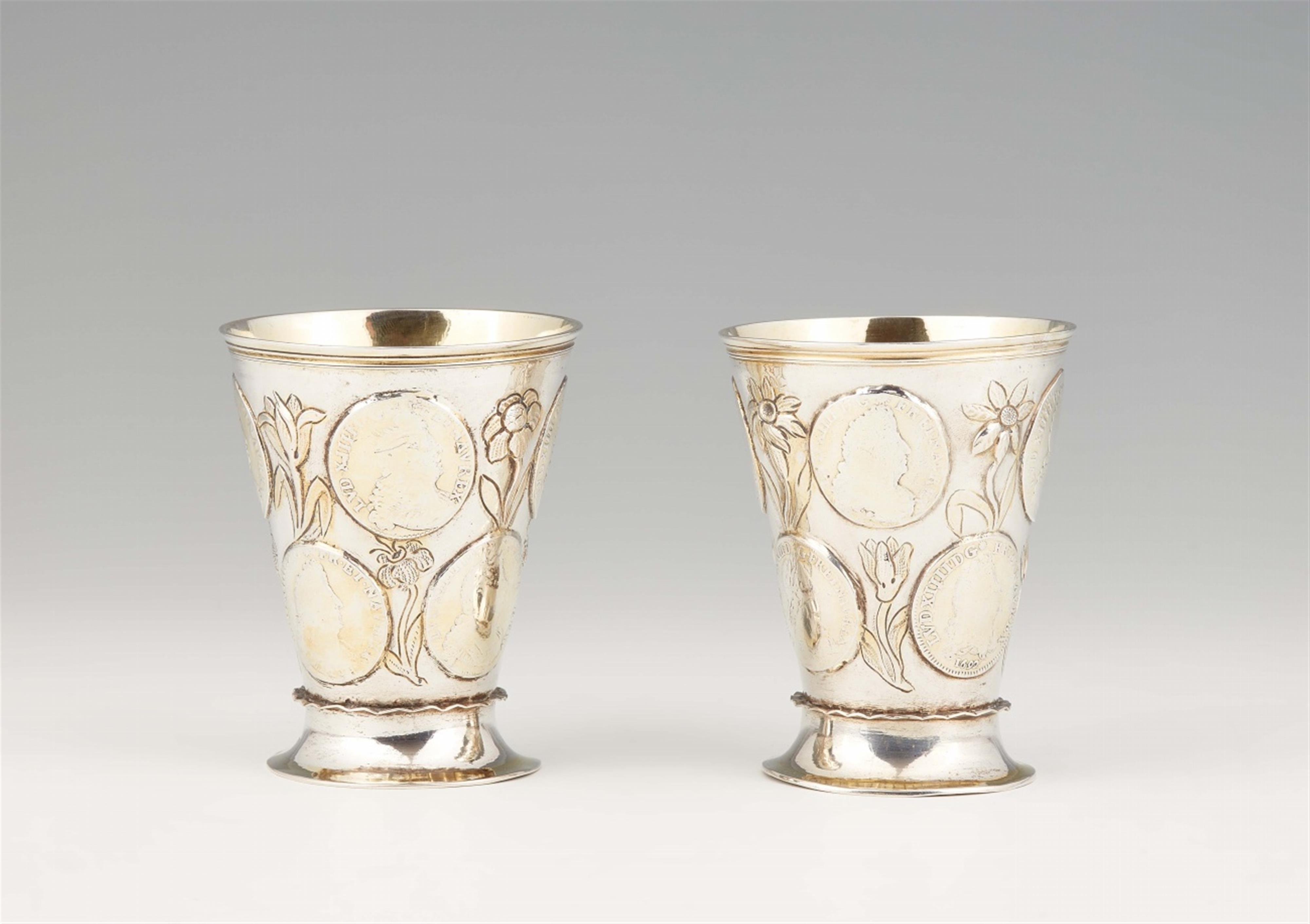 A pair of parcel gilt Gdansk silver coin-set beakers - image-1