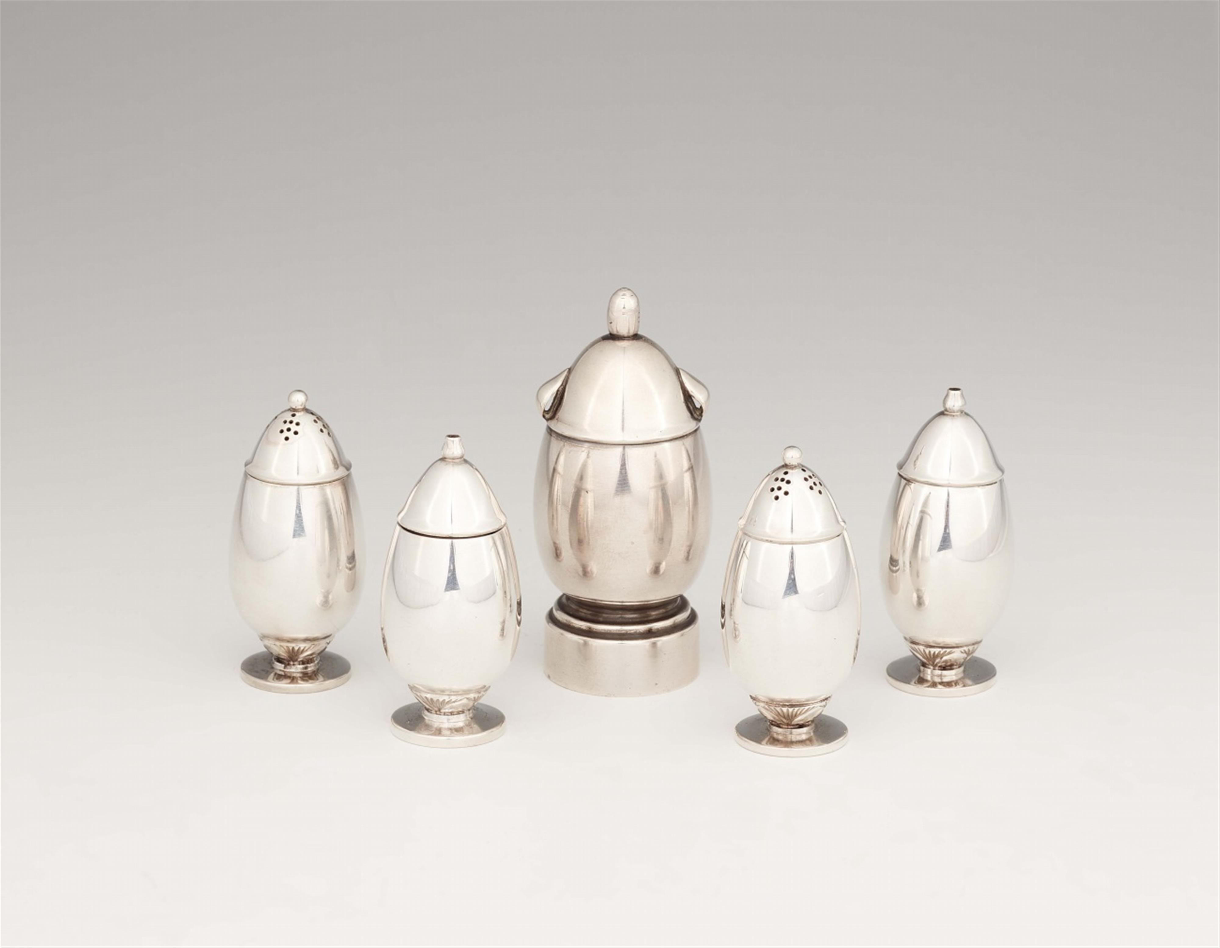 A Georg Jensen silver pepper mill no. 629 with four small cruets - image-1