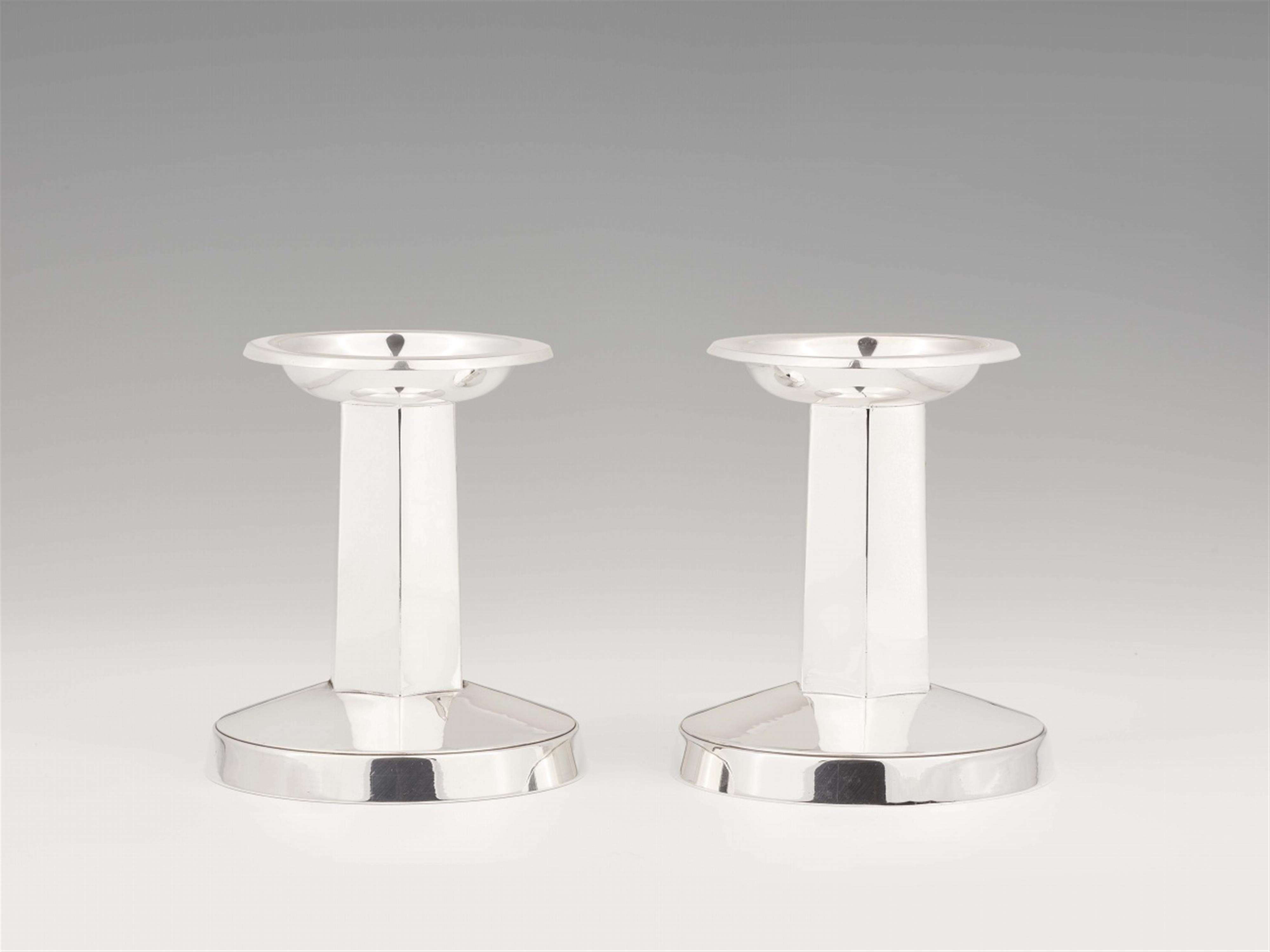 A pair of Swedish silver candelabra - image-1