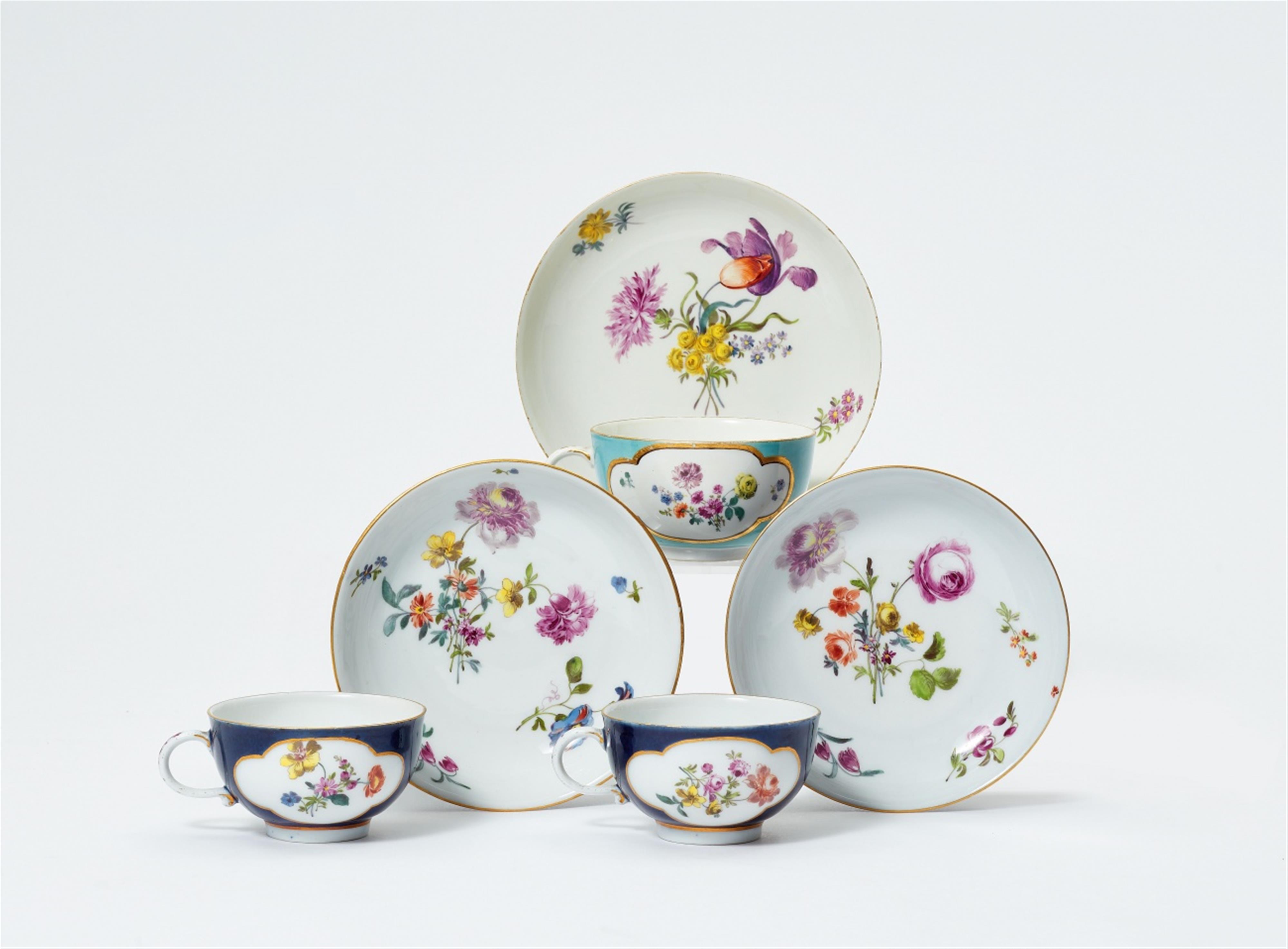 Three Meissen porcelain cups and saucers with coloured grounds - image-1