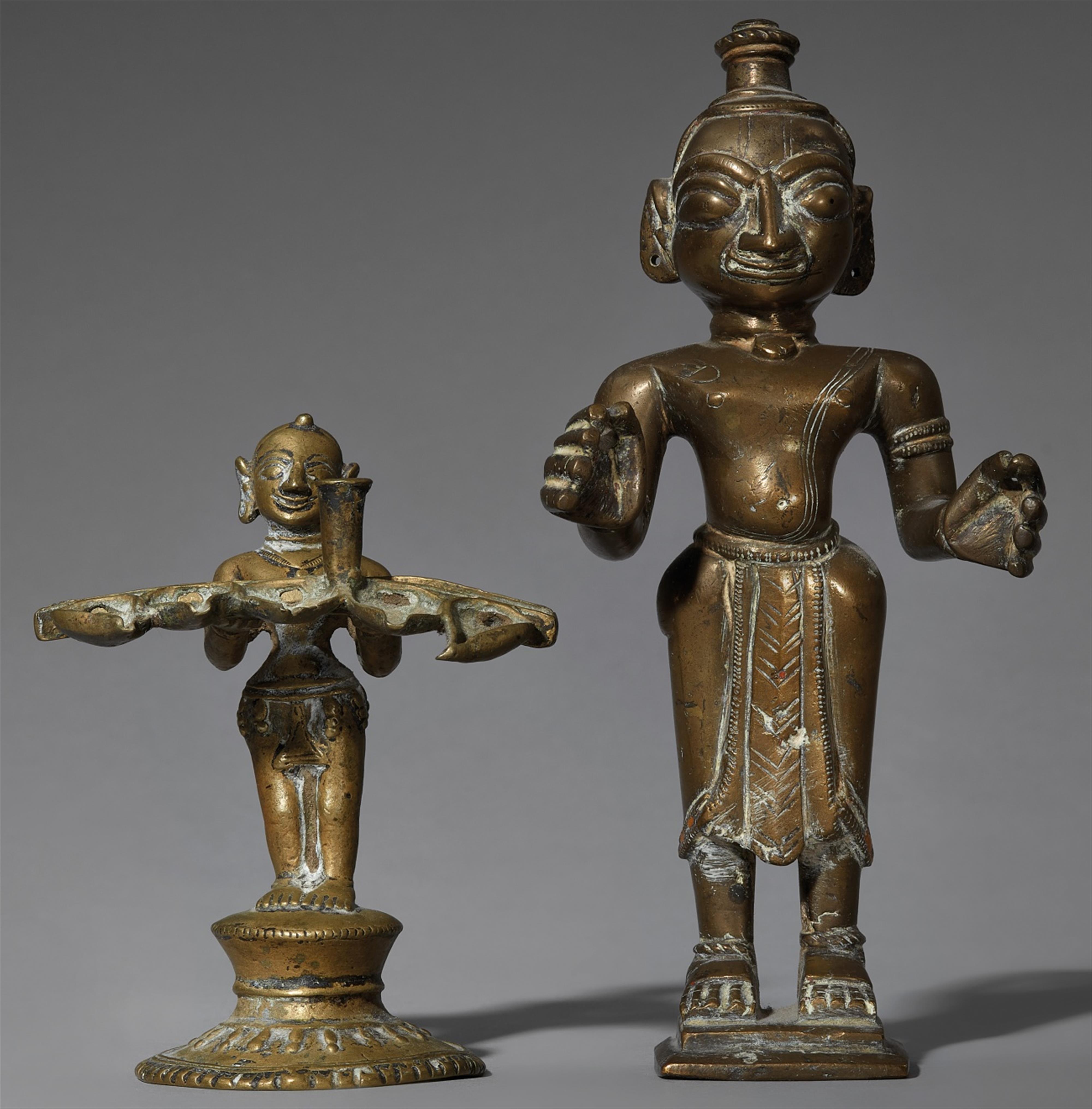 A Bengali brass male figure and an oil lamp. 19th/20th century - image-1