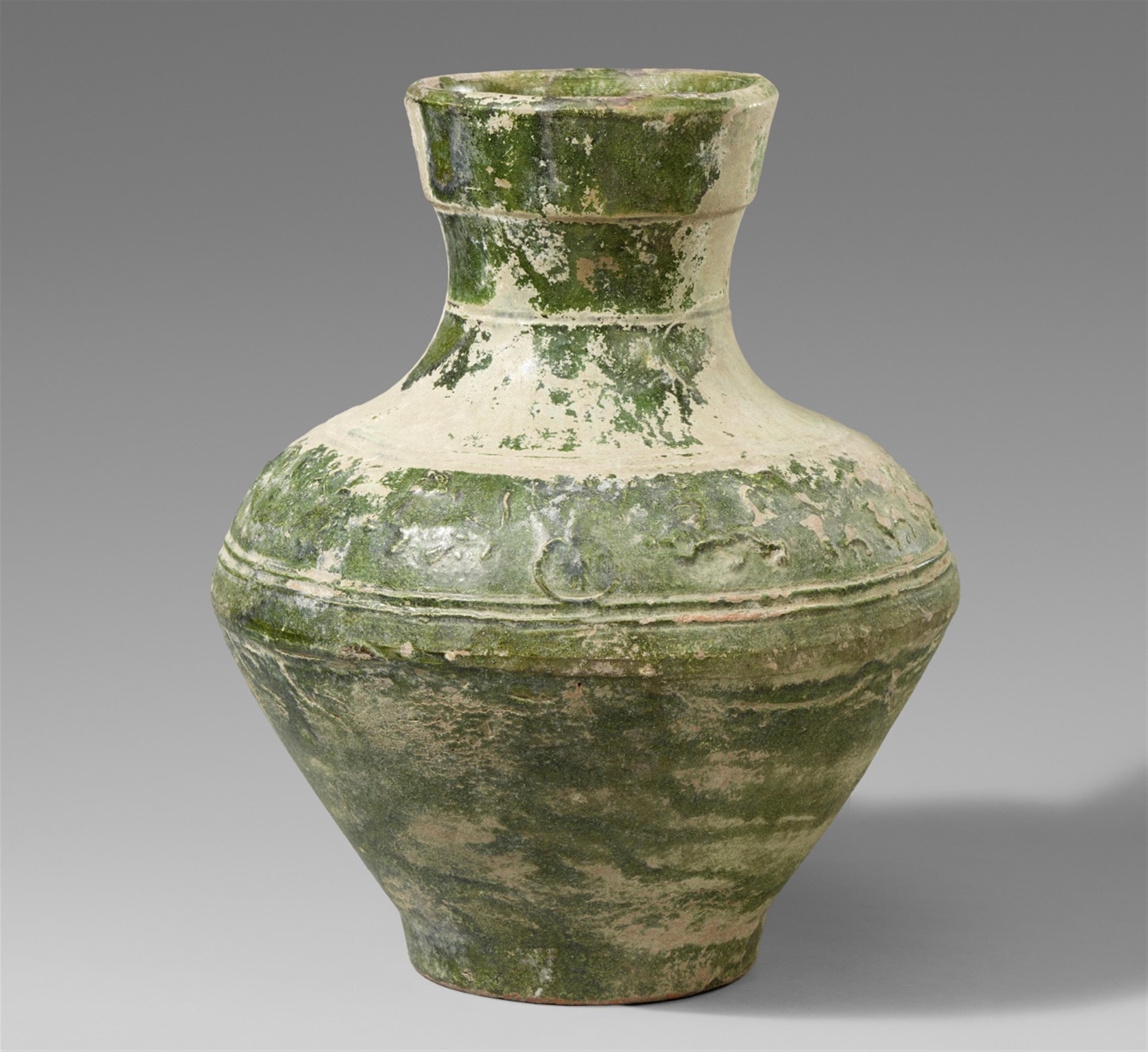 A green-glazed hu-shaped jar. Eastern Han dynasty (25-220) - image-1