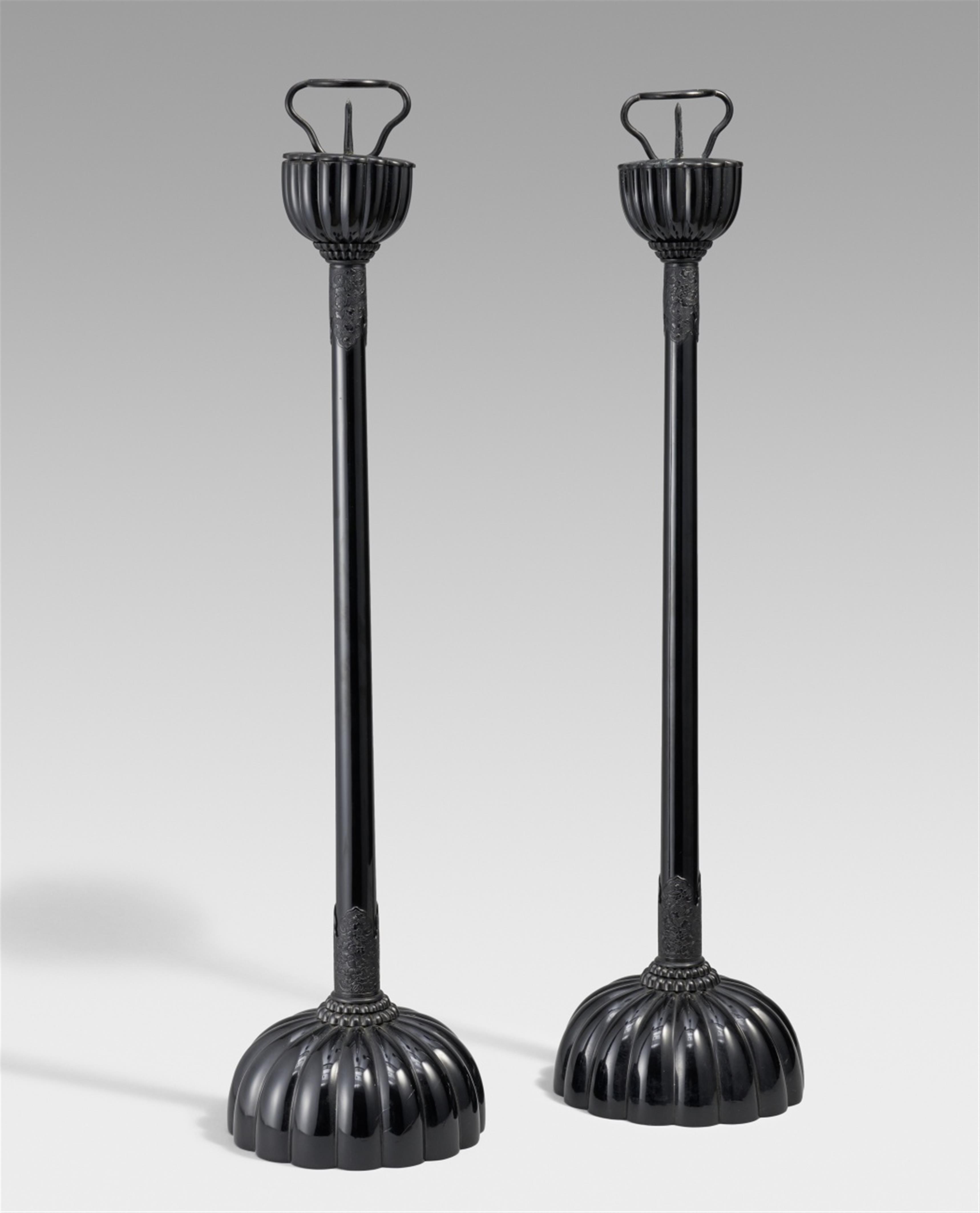 Two tall black lacquer temple candlesticks. 20th century - image-1