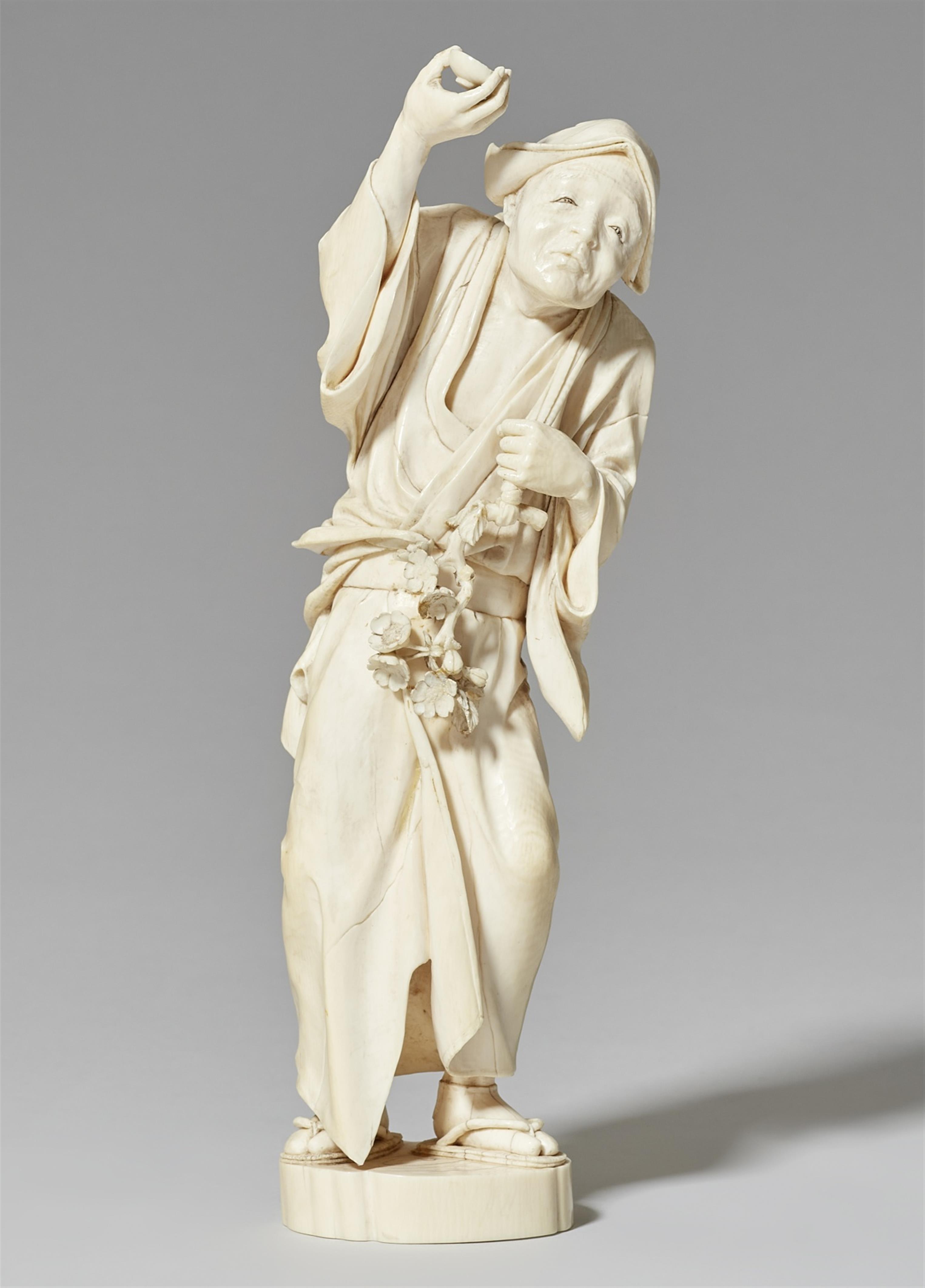 An ivory okimono of a man with a sakura branch. Late 19th century - image-1