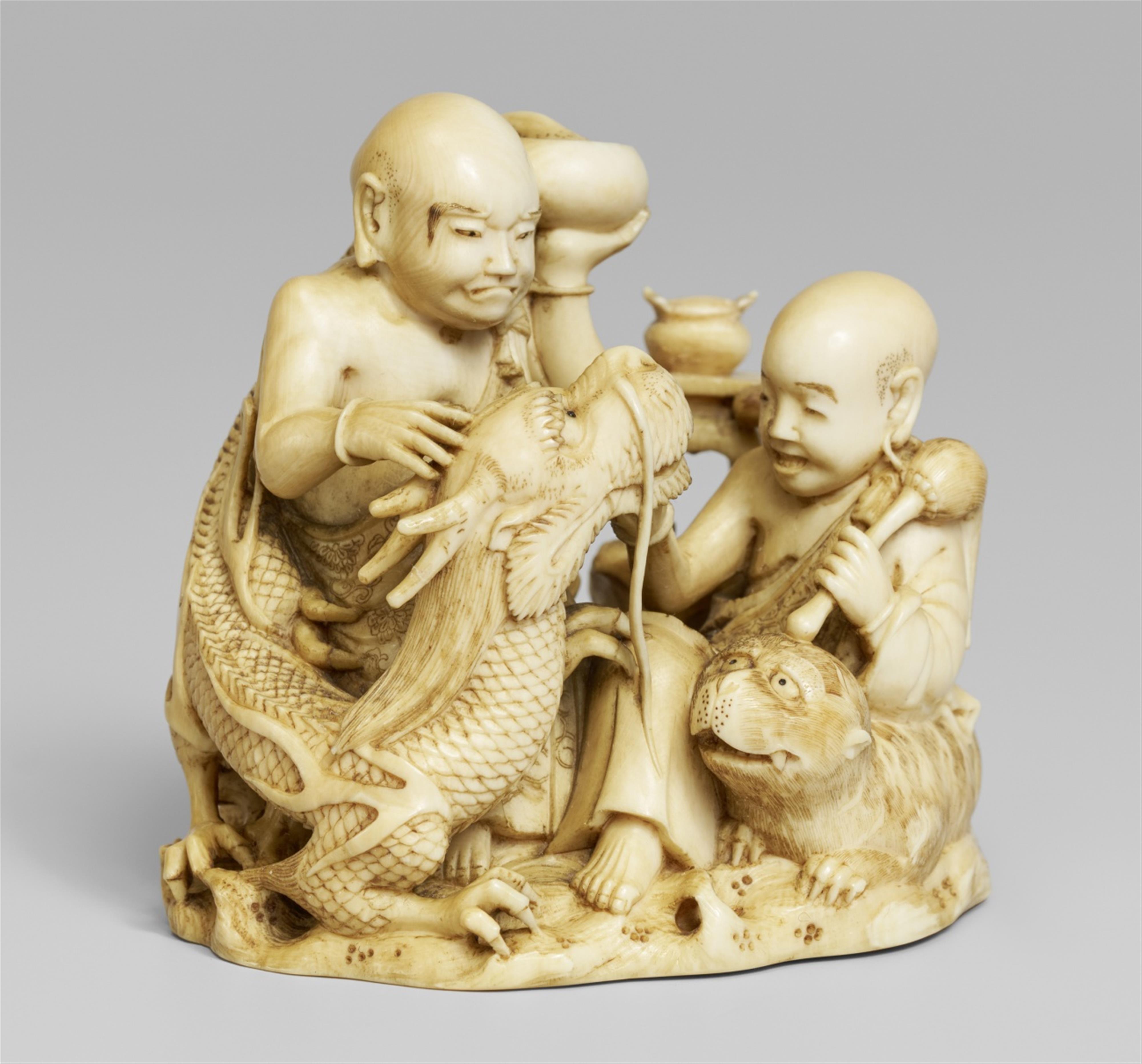 A small ivory okimono of two rakan. Late 19th century - image-1