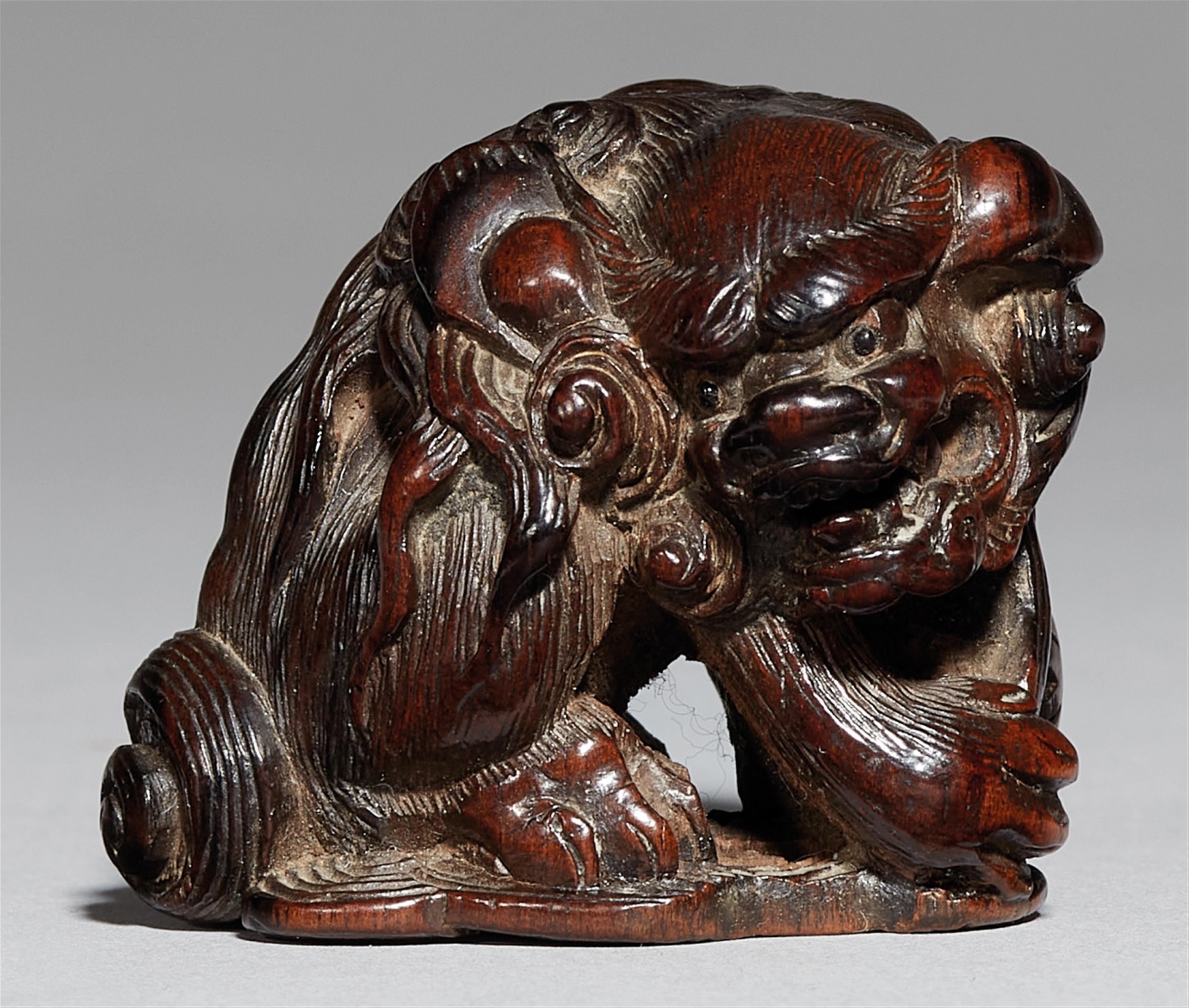 A large dark wood netsuke of a shishi. 19th century - image-1