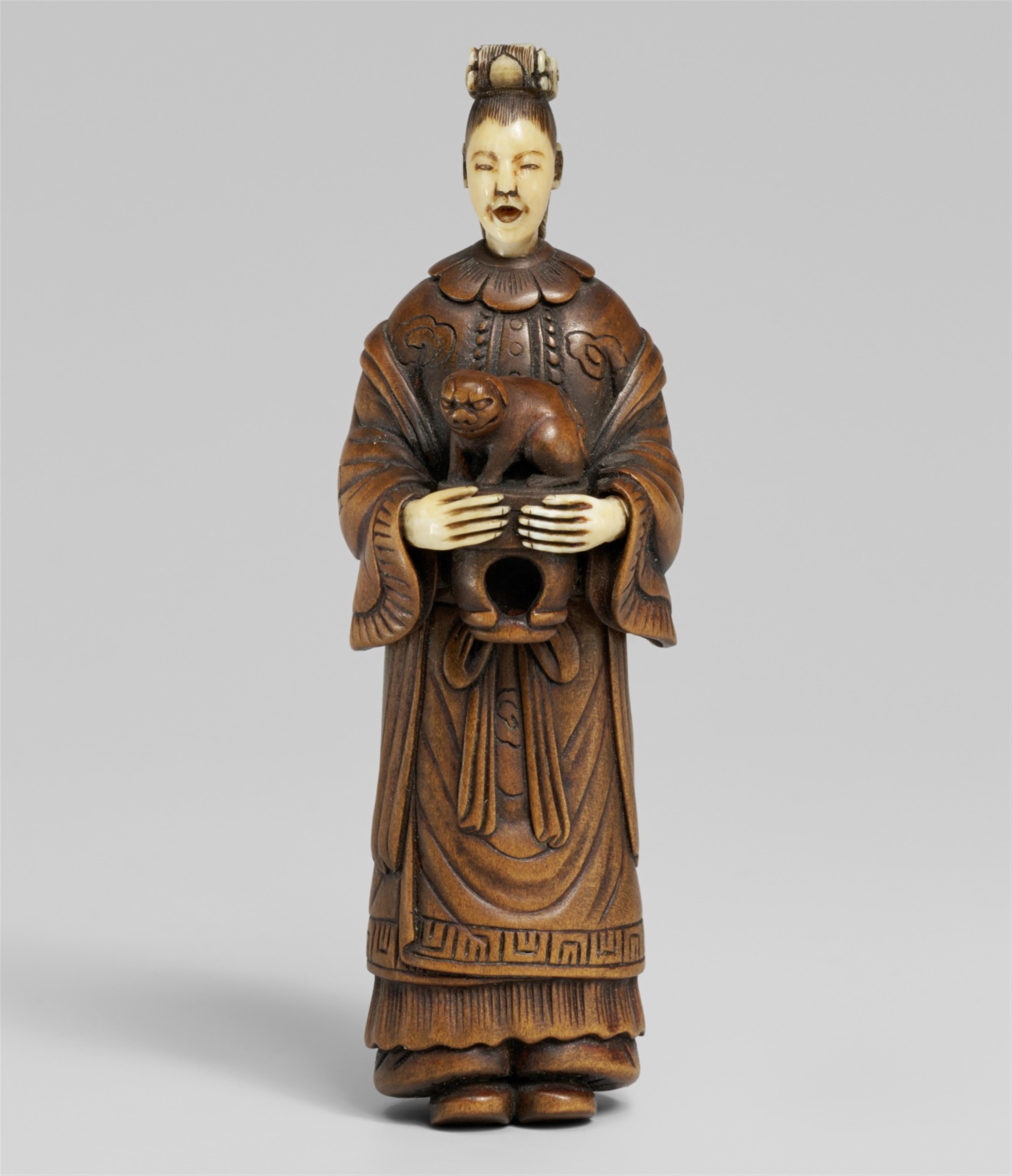 An ivory and wood shunga netsuke of a Chinese lady with a shishi. 19th century - image-1