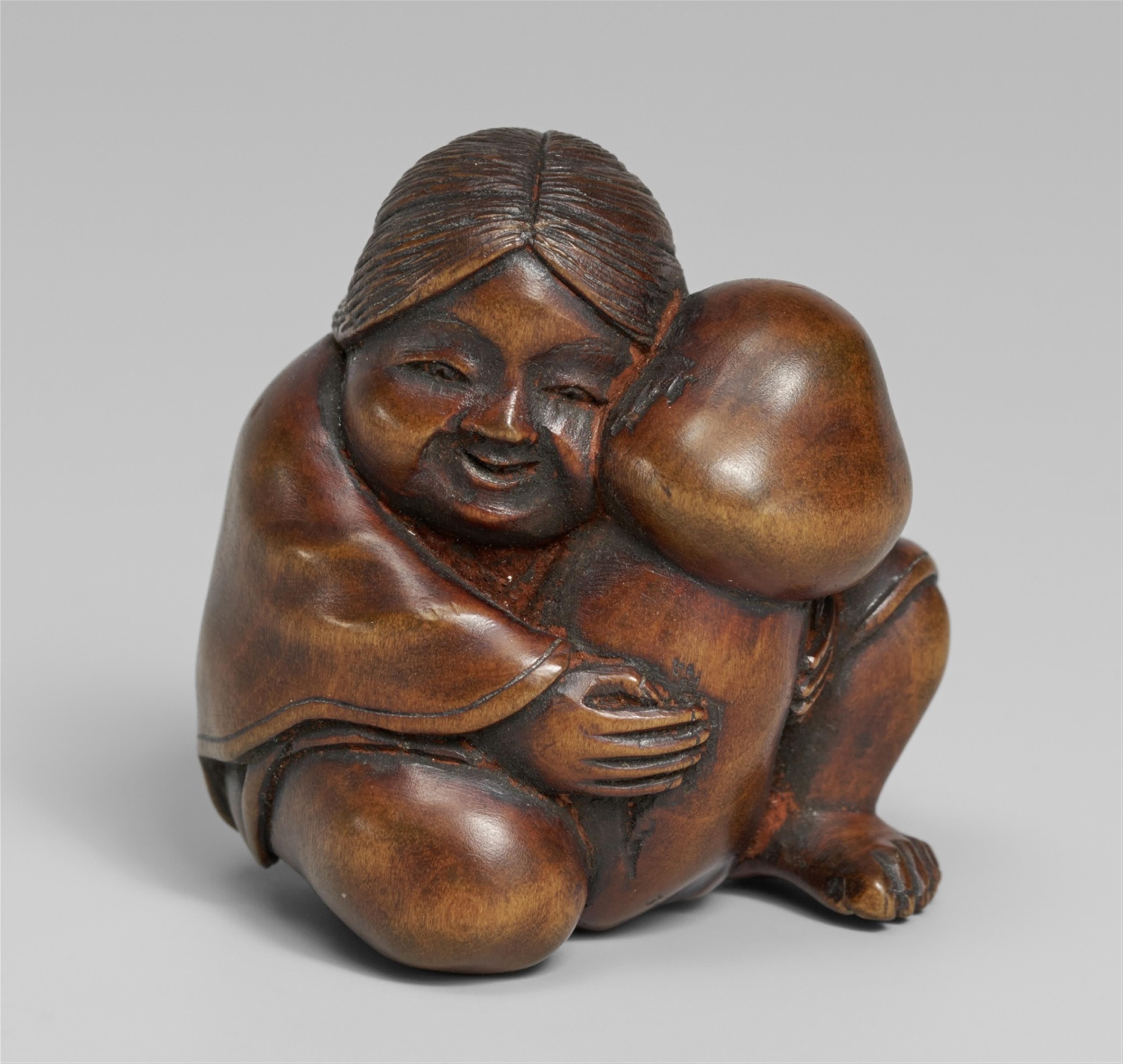 A boxwood shunga netsuke of Okame. 19th century - image-1