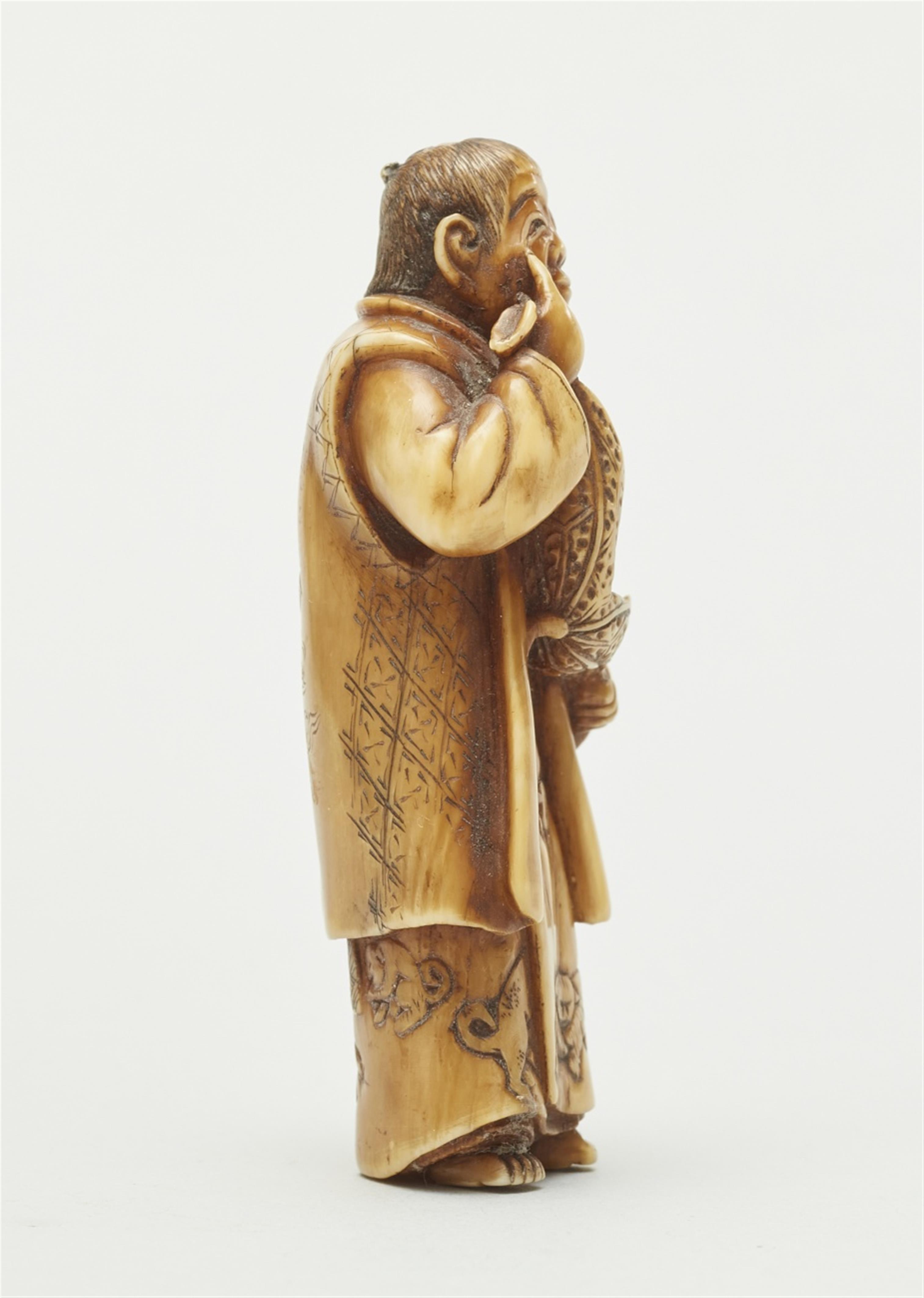 An ivory netsuke of a boy with a hozuki. Late 19th century - image-3