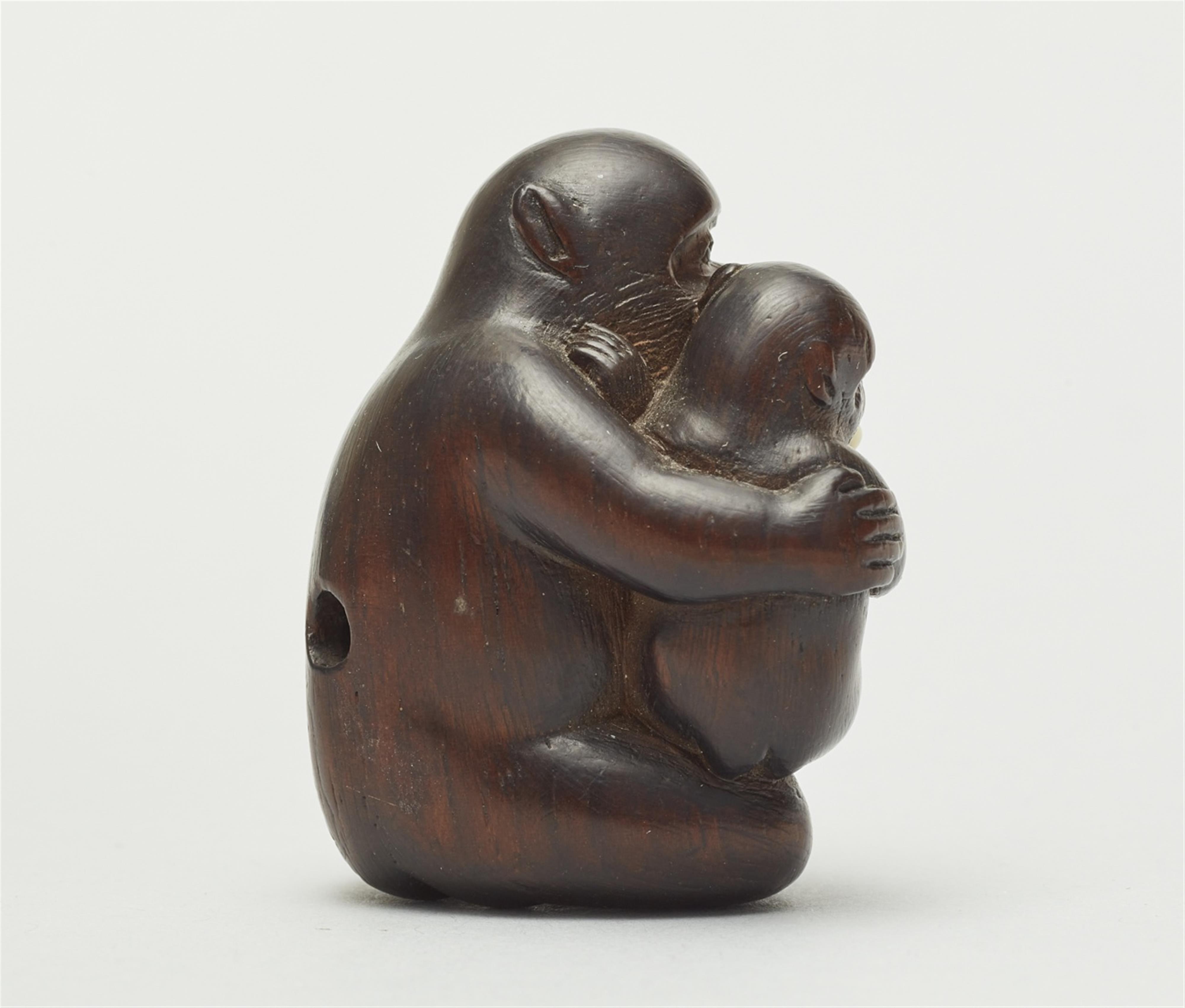 A reddish cherry wood netsuke of two monkeys, by Hidechika. Mid-19th century - image-3