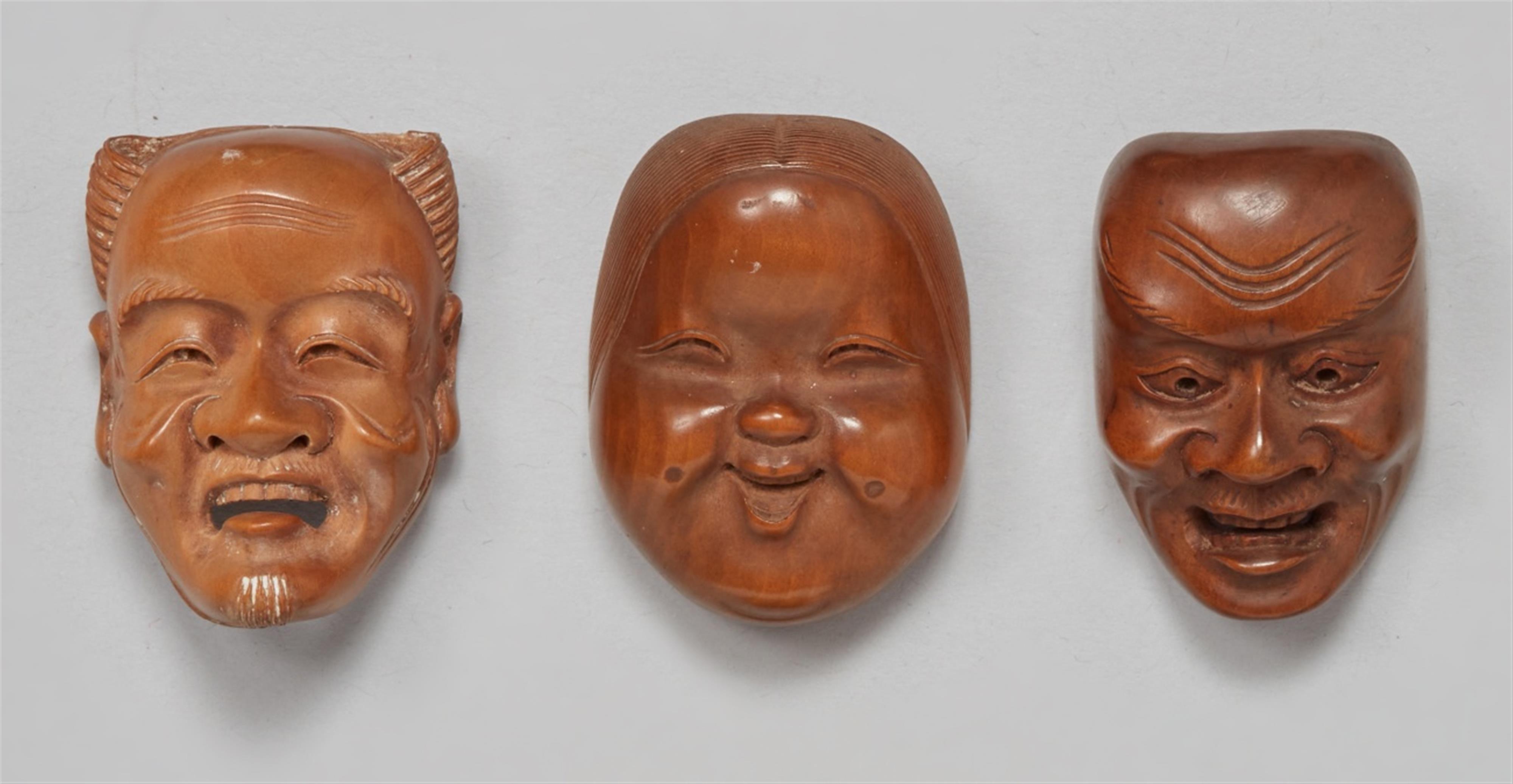 Three boxwood mask netsuke from a set. Around 1900 - image-1