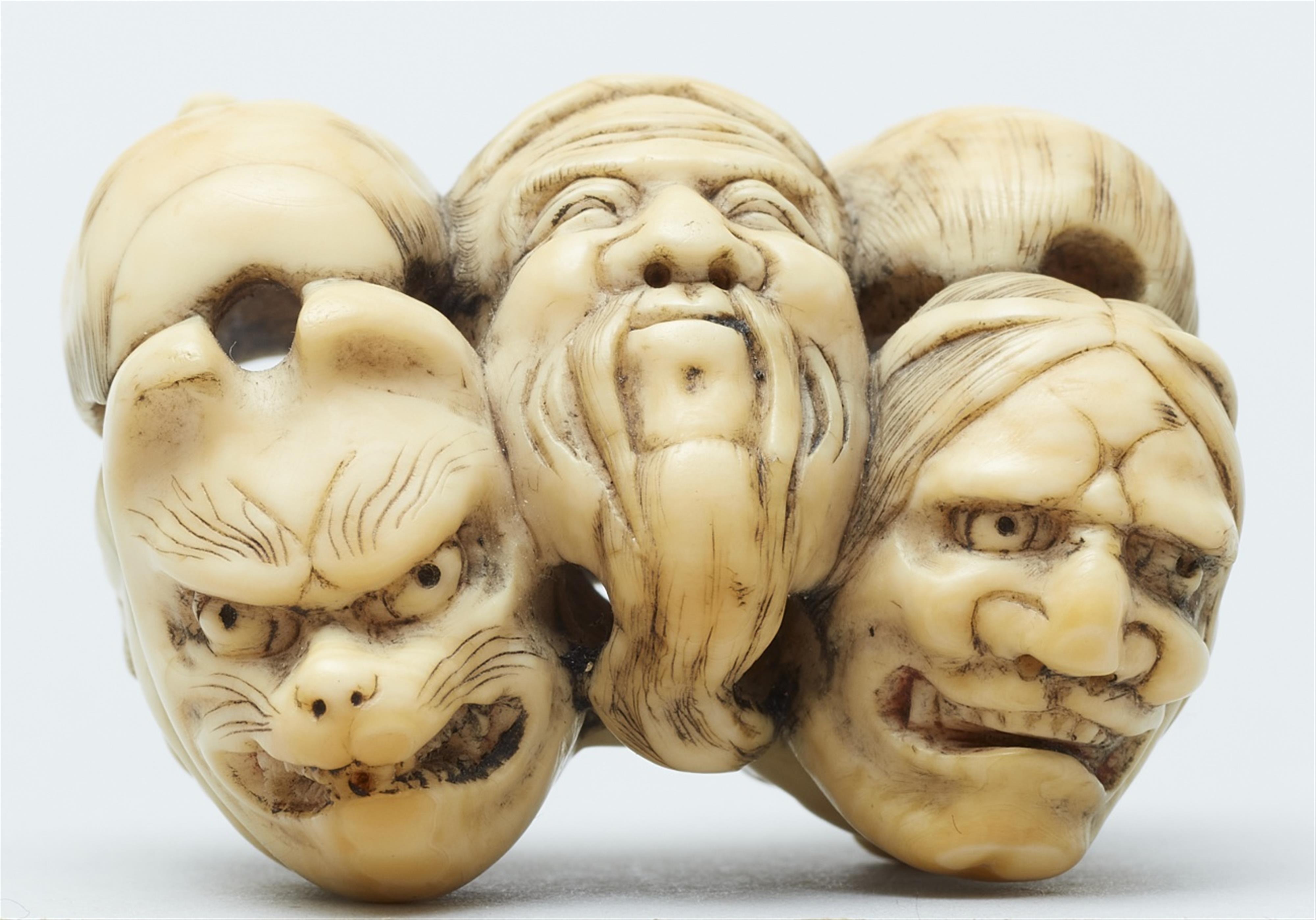 An ivory netsuke of a group of masks. Mid-19th century - image-3