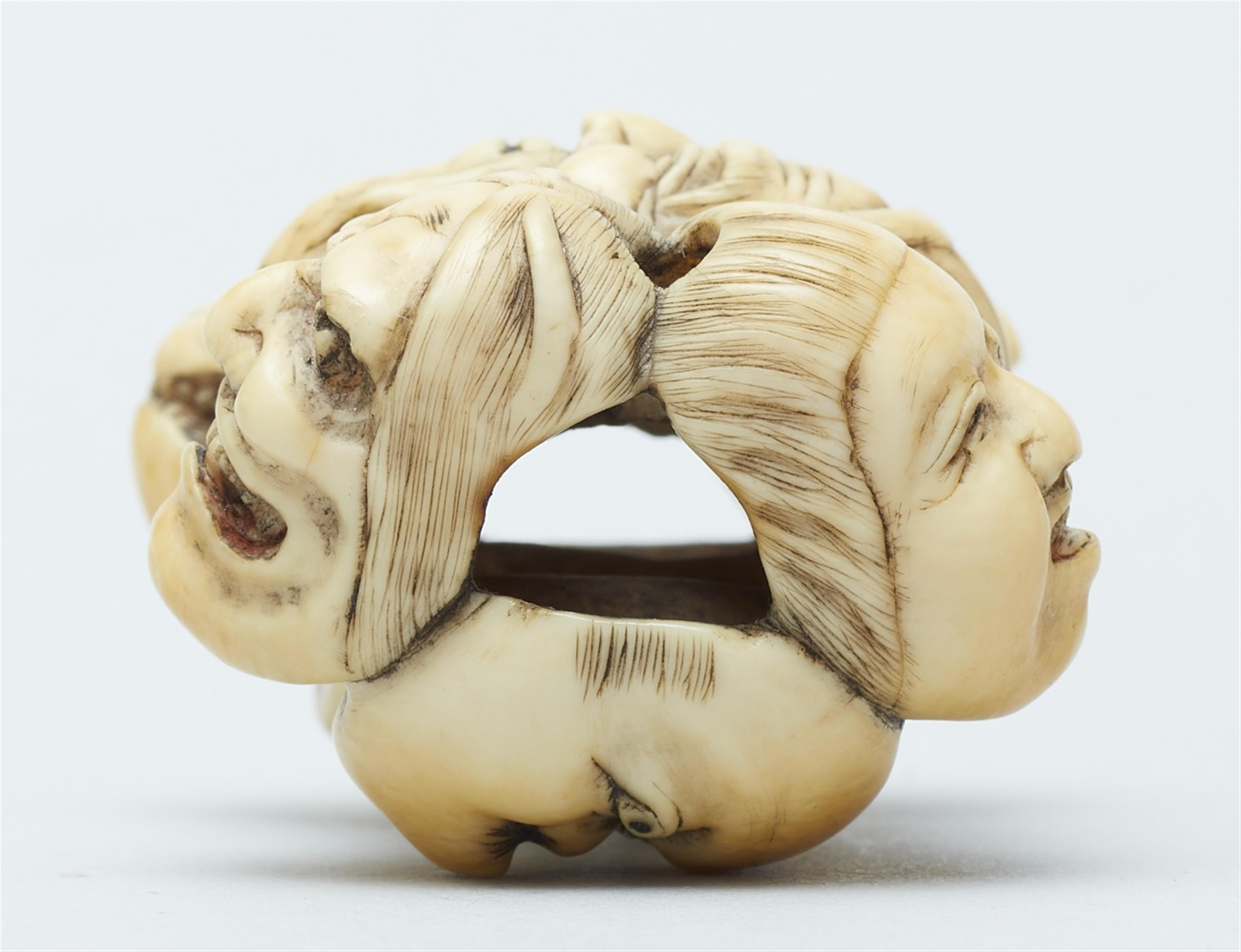 An ivory netsuke of a group of masks. Mid-19th century - image-7