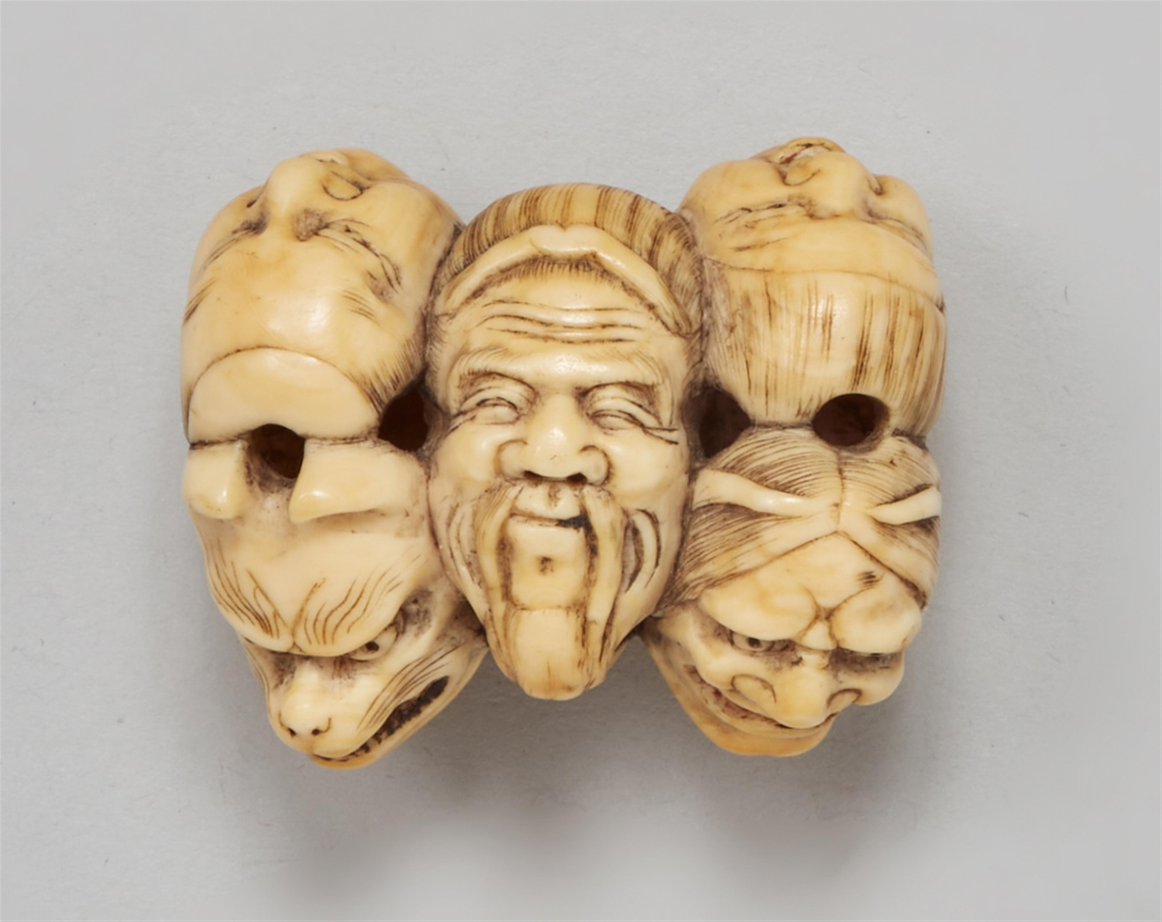 An ivory netsuke of a group of masks. Mid-19th century - image-1