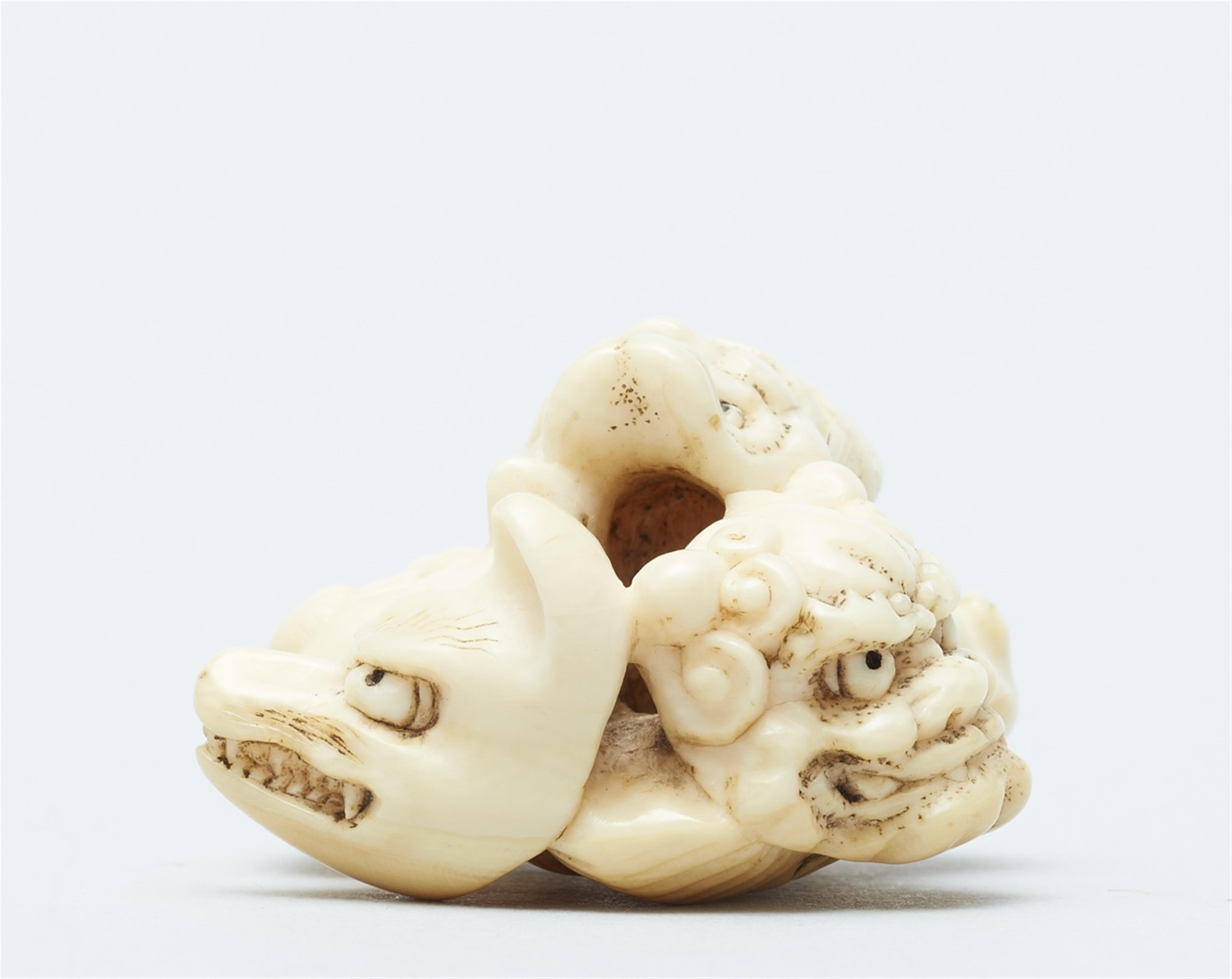 An ivory netsuke of a group of masks. Mid-19th century - image-5