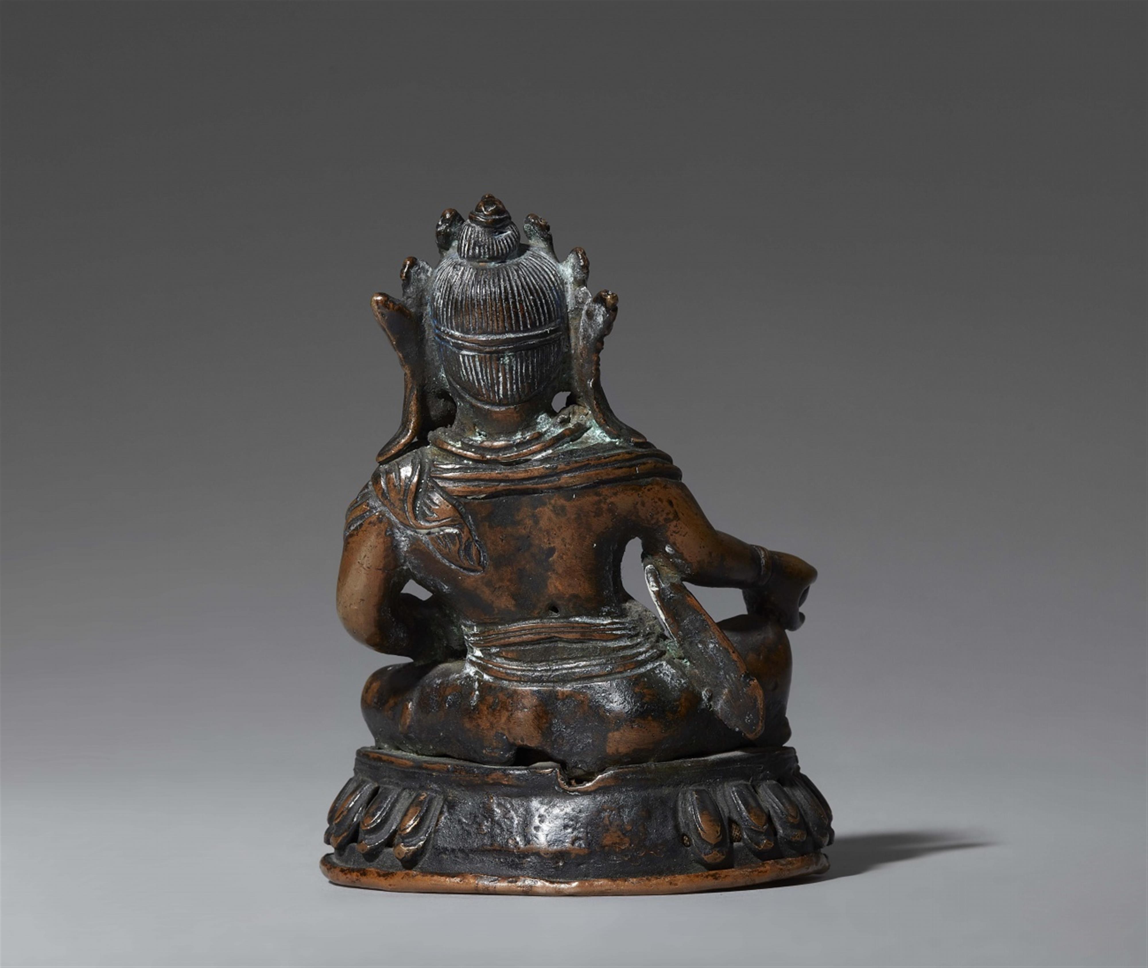 A Tibetan or Nepalese silver-inlaid dark bronze figure of Jambhala. 17th/18th century - image-2