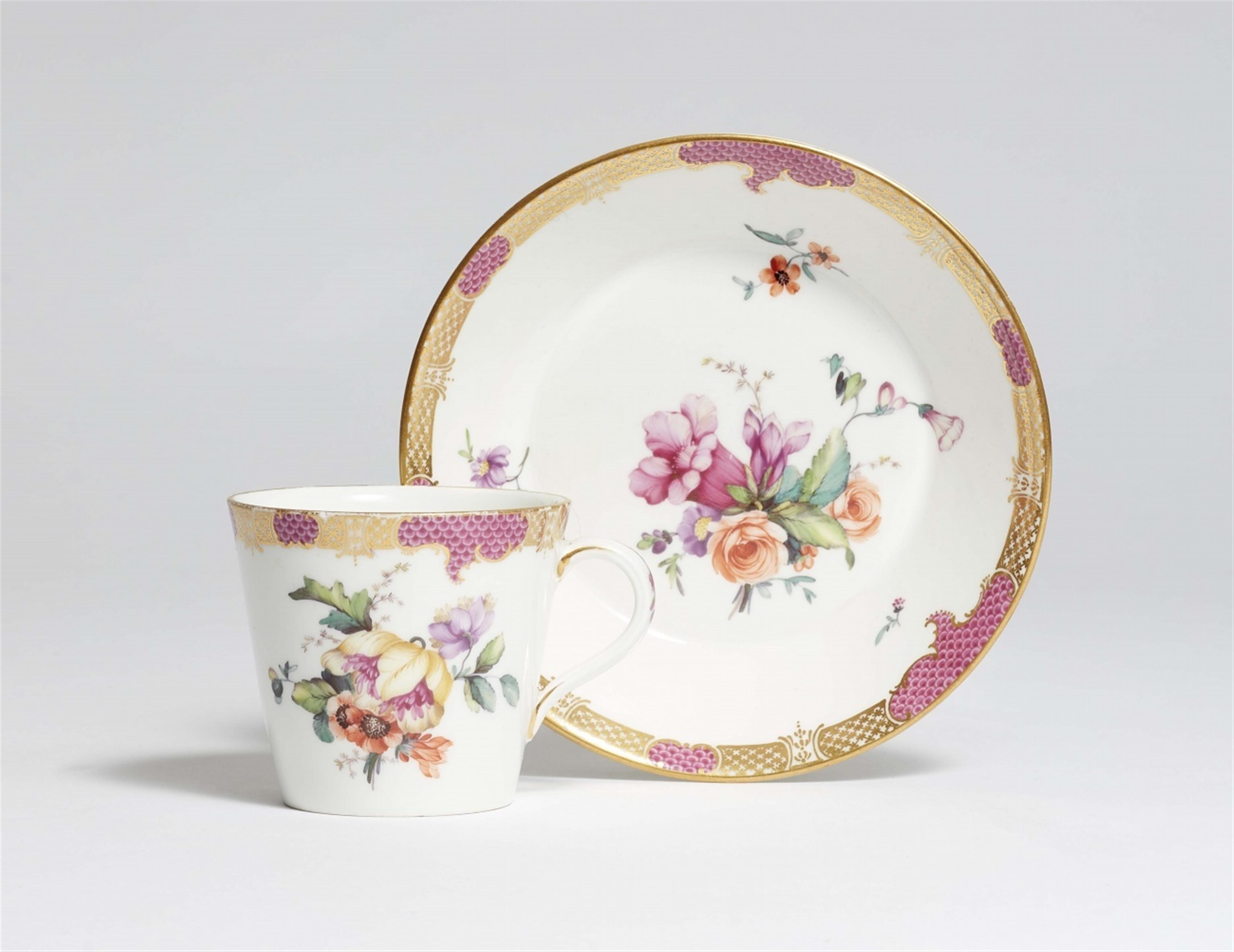 A Berlin KPM porcelain cup and saucer with floral decoration - image-1