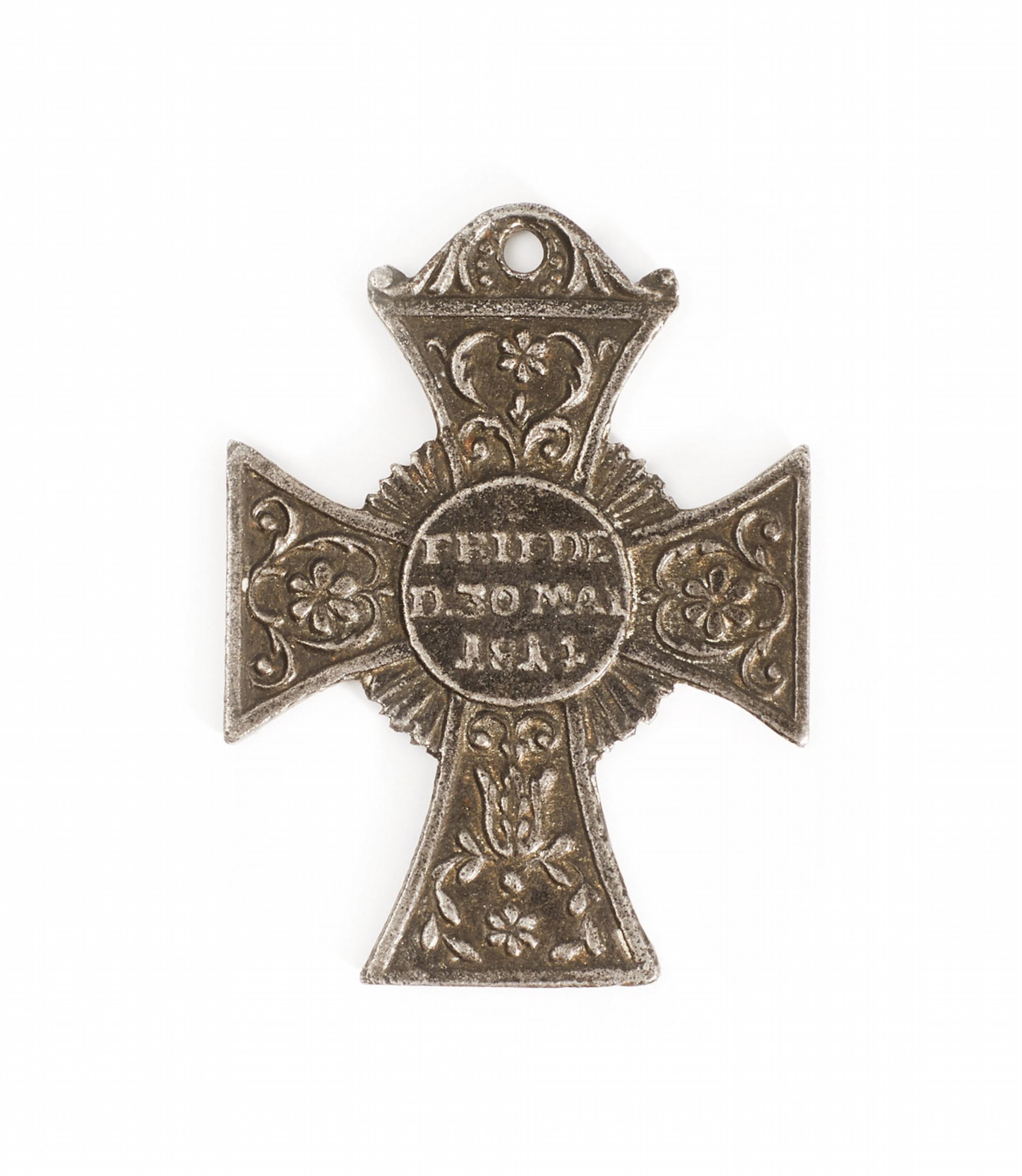 A cast iron cross pendant with a commemorative inscription - image-1