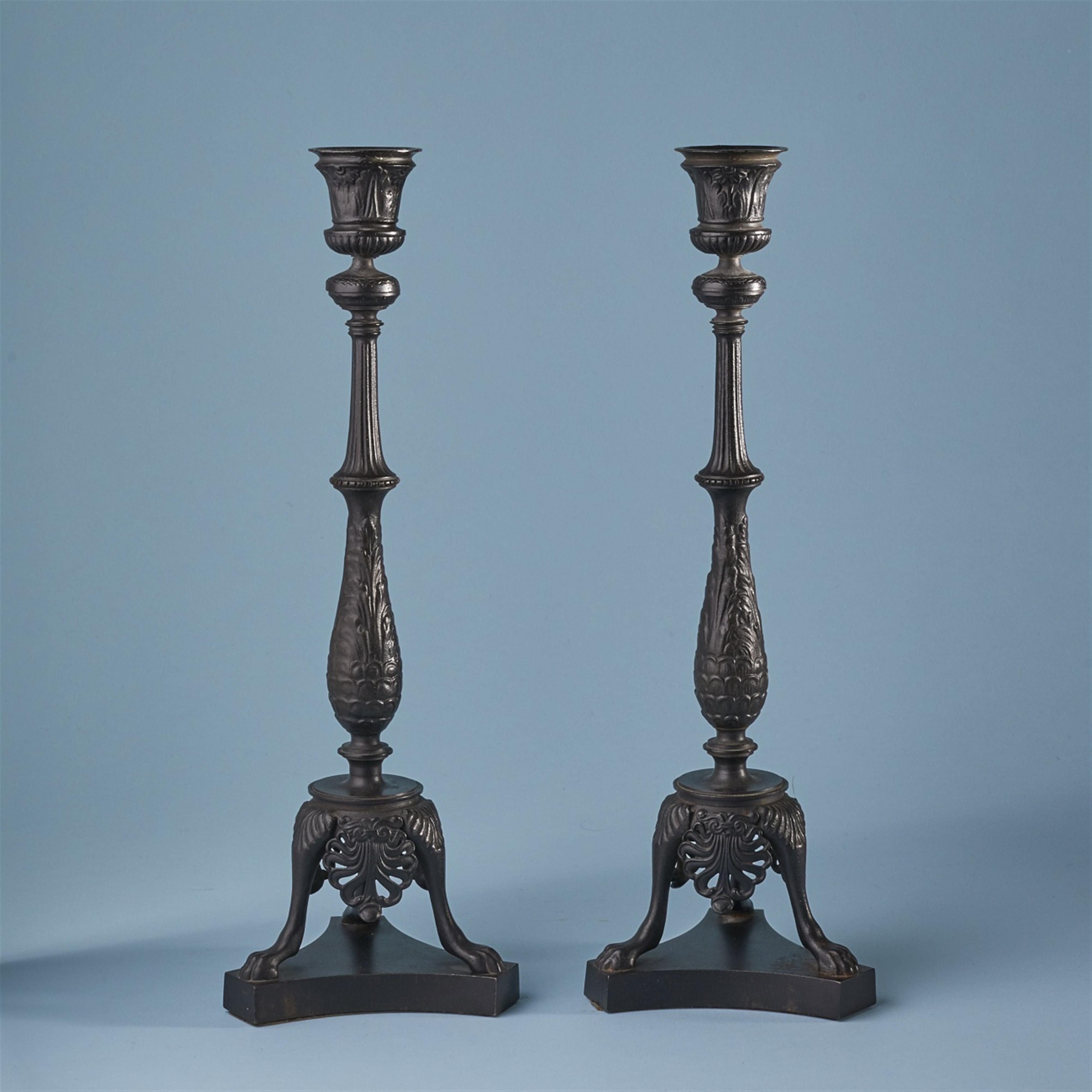 Two cast iron candlesticks - image-1