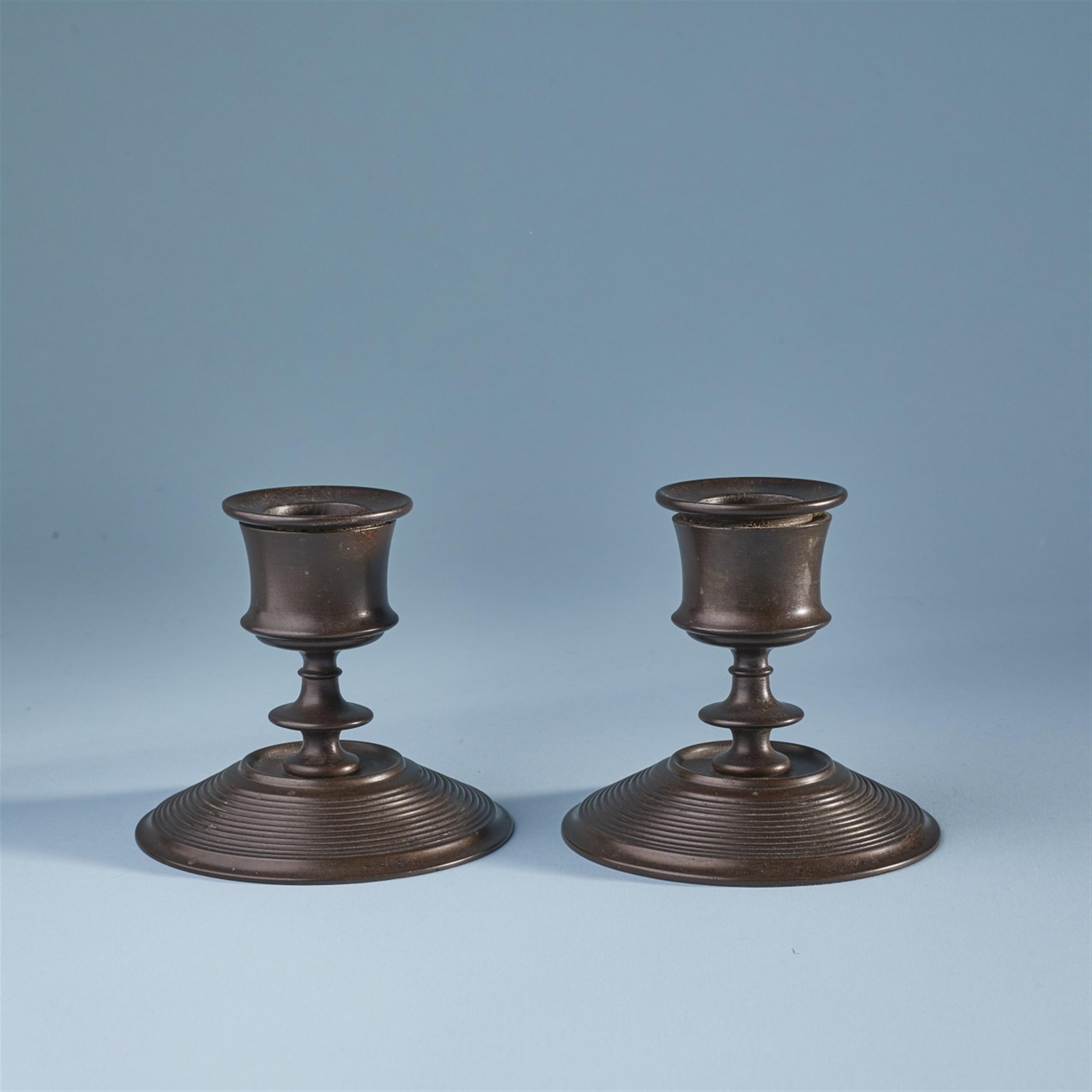 Two cast iron candlesticks - image-1