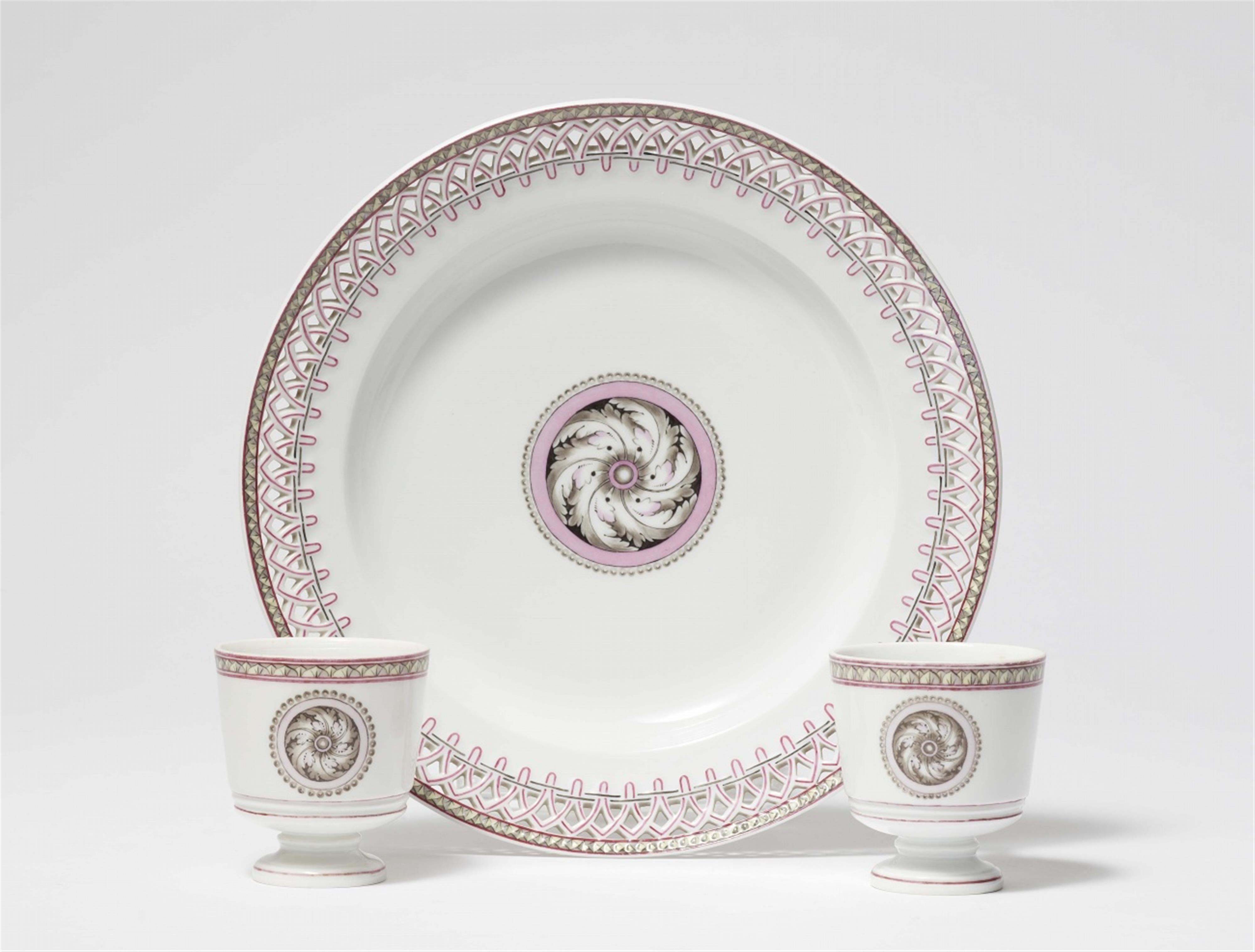 Two Neoclassical Berlin KPM porcelain cups and one dessert plate with grisaille decor - image-1