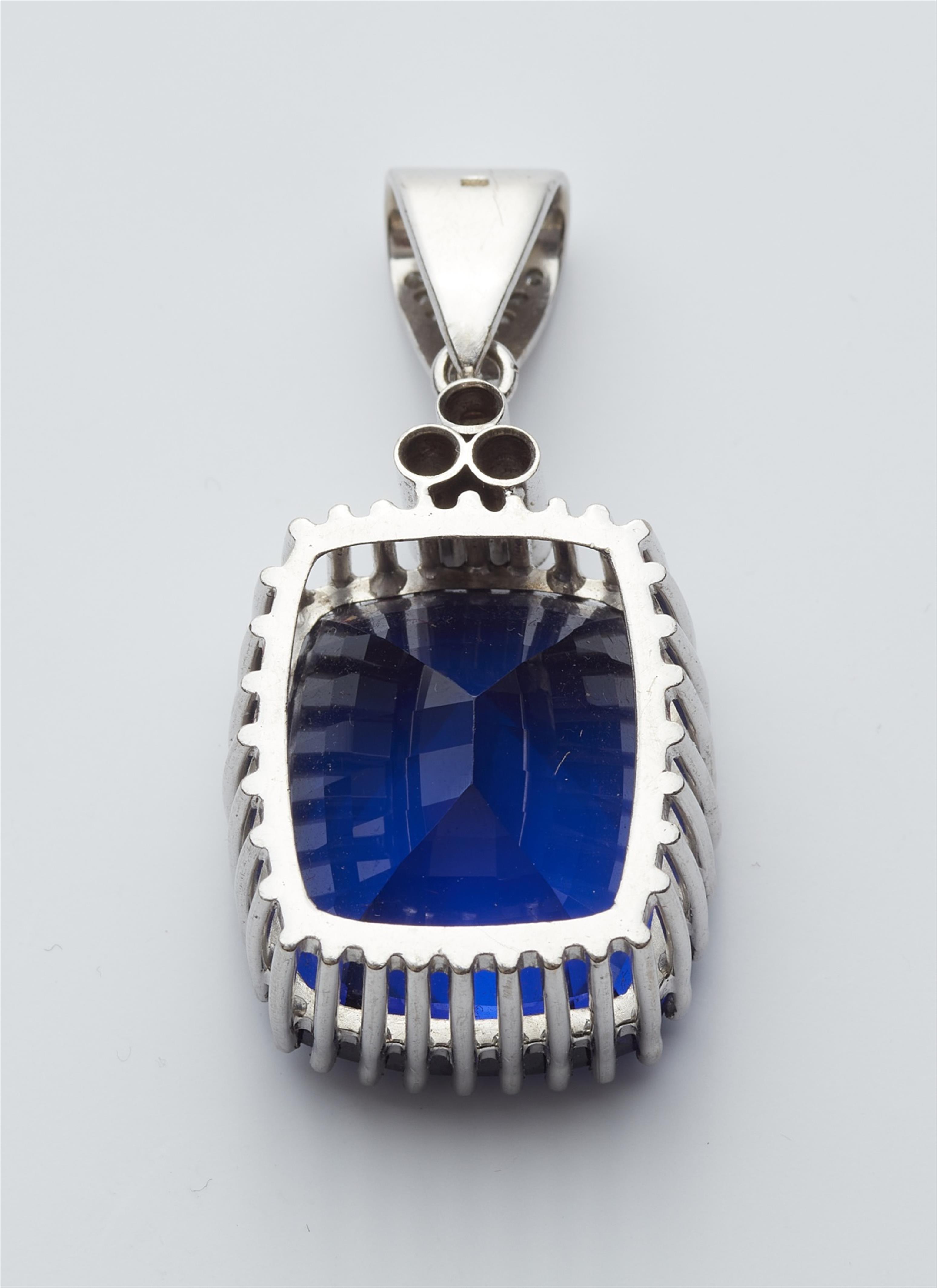 An 18k white gold pendant with a large tanzanite - image-2