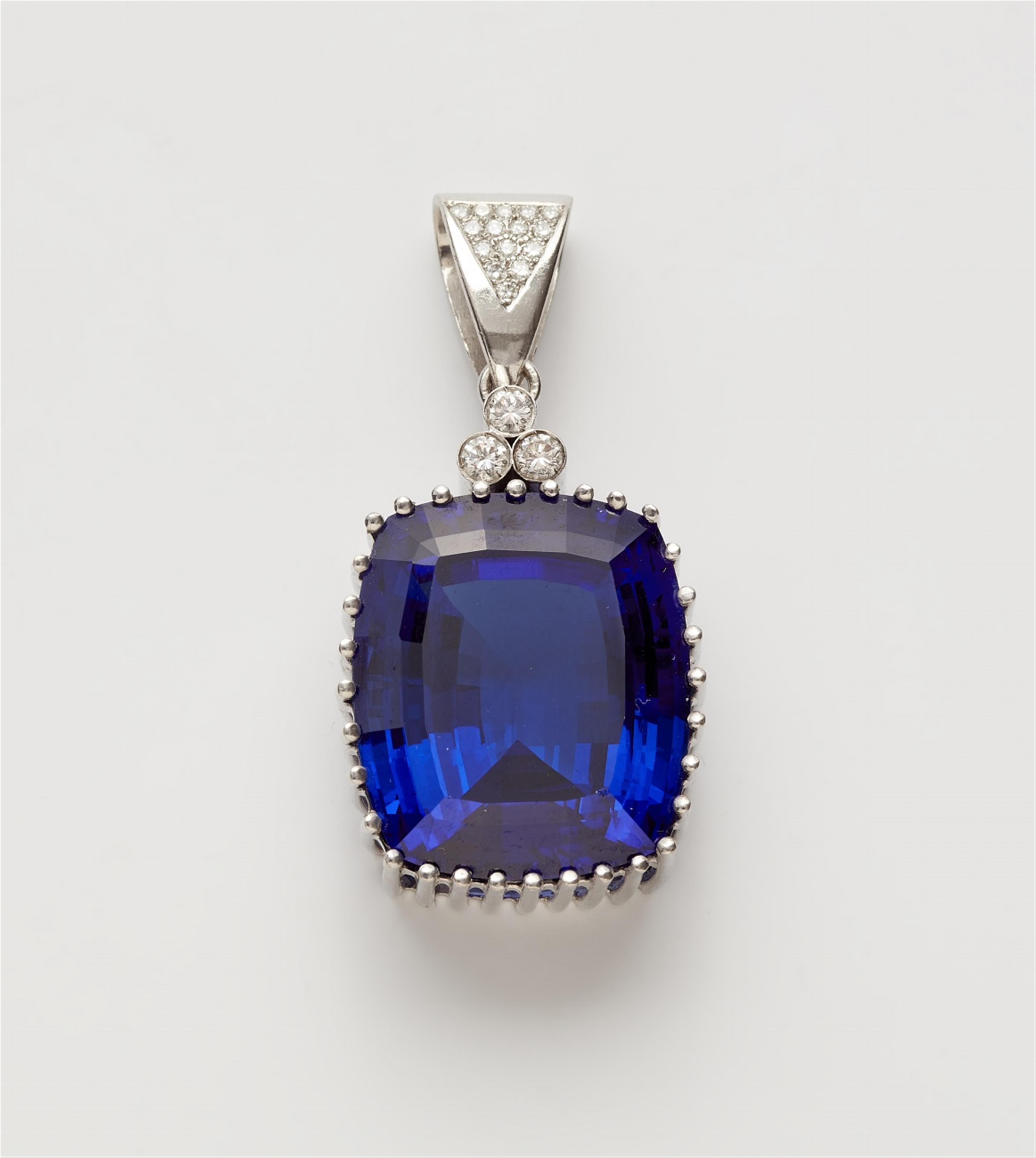 An 18k white gold pendant with a large tanzanite - image-1