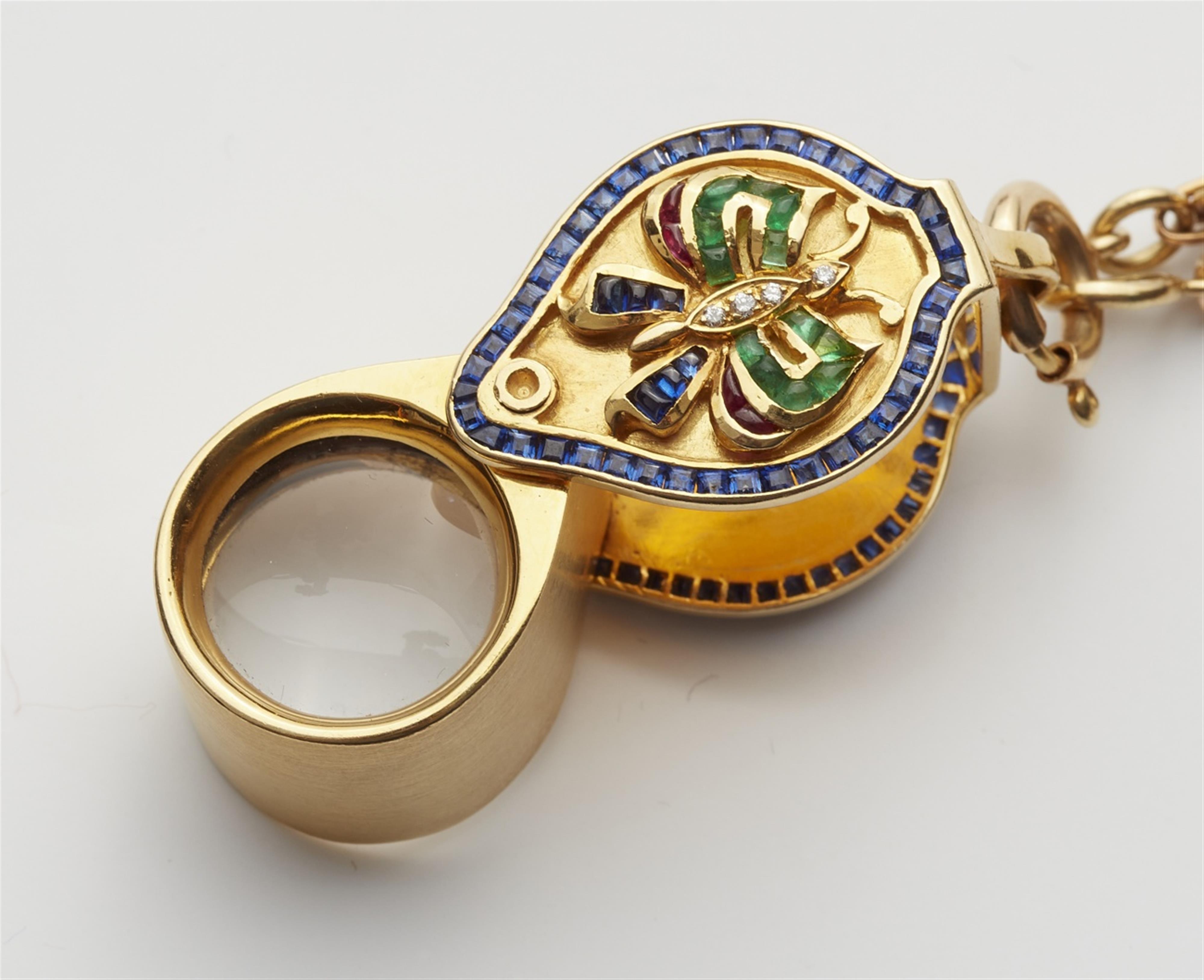 An 18k gold watch chain with a jeweller's loupe - image-2