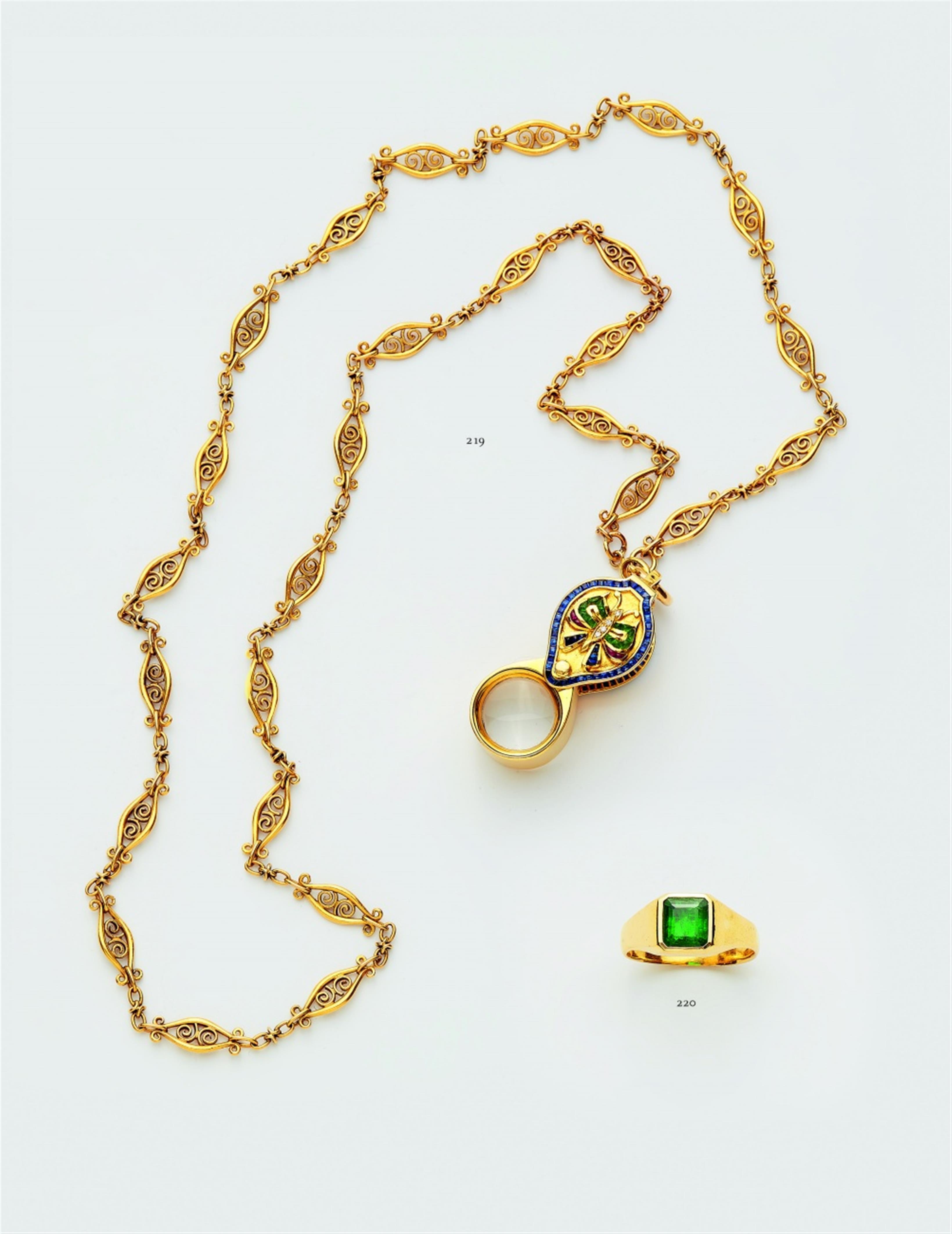 An 18k gold watch chain with a jeweller's loupe - image-4