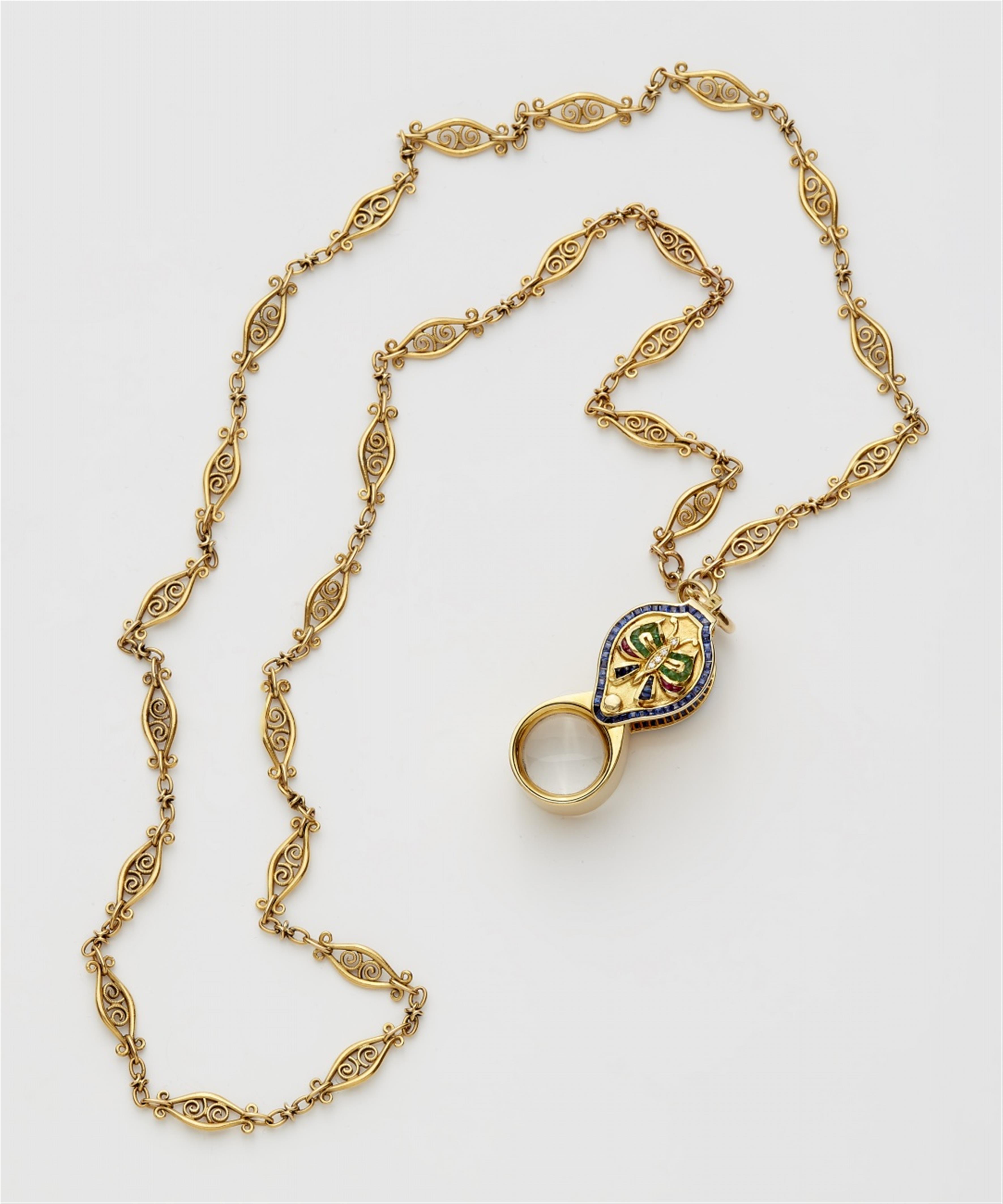 An 18k gold watch chain with a jeweller's loupe - image-1