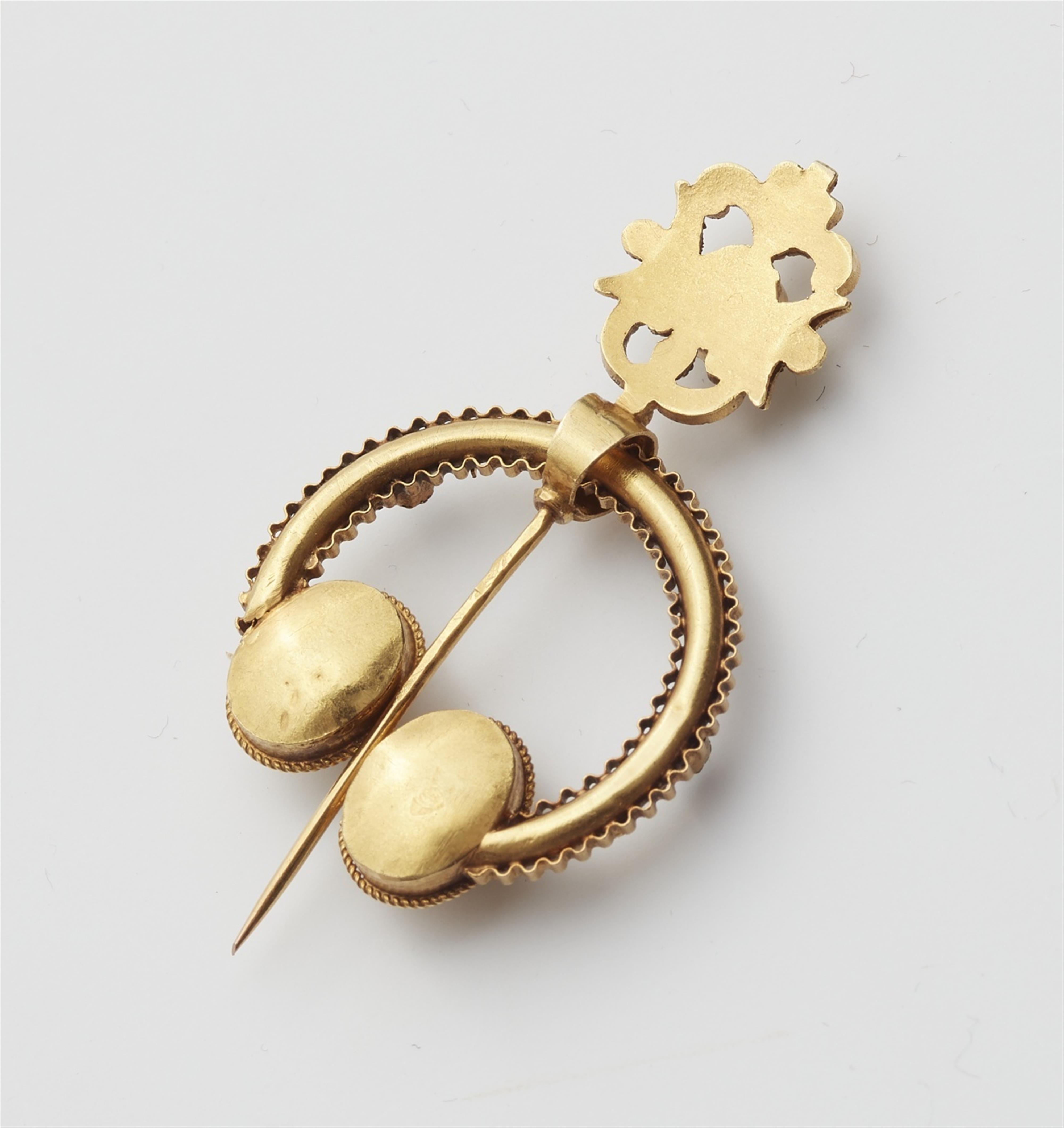 A 14k gold Celtic style fibula brooch - image-2