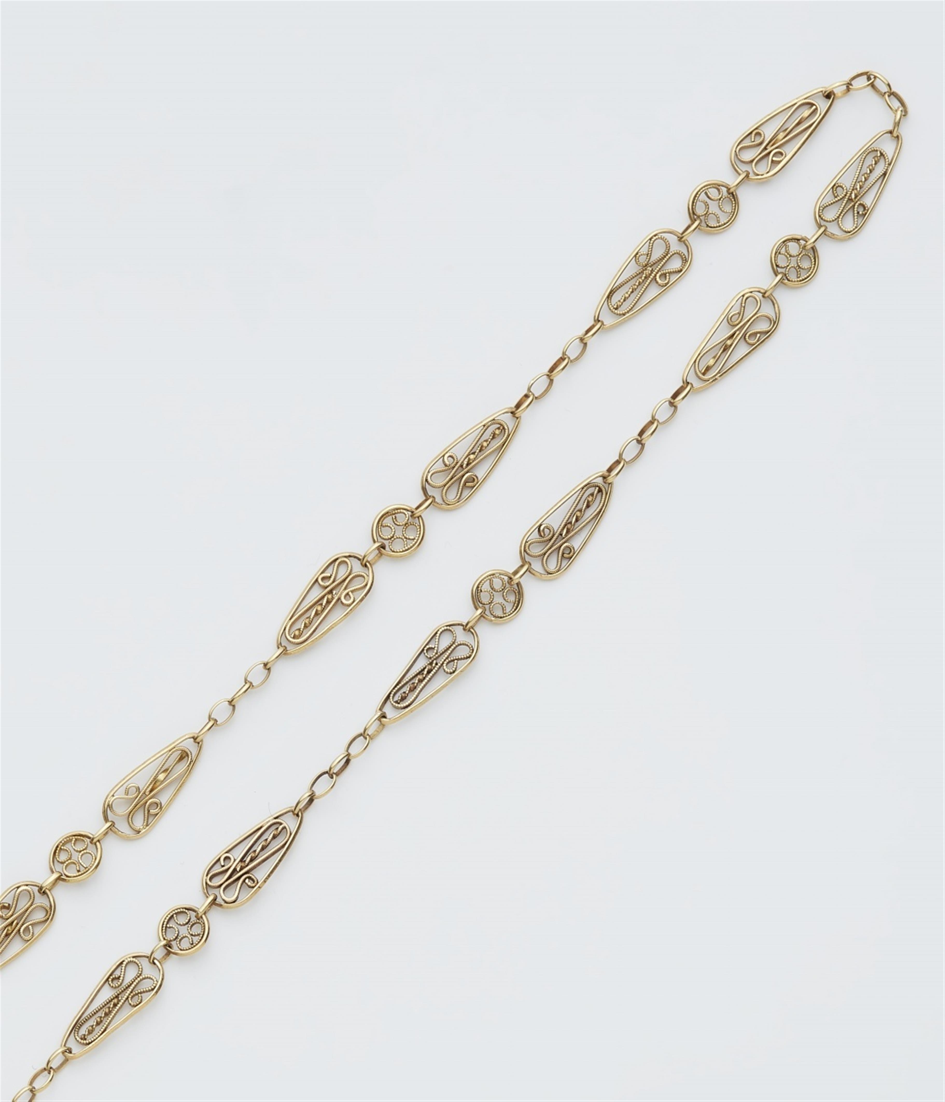 A French 18k gold watch chain - image-1