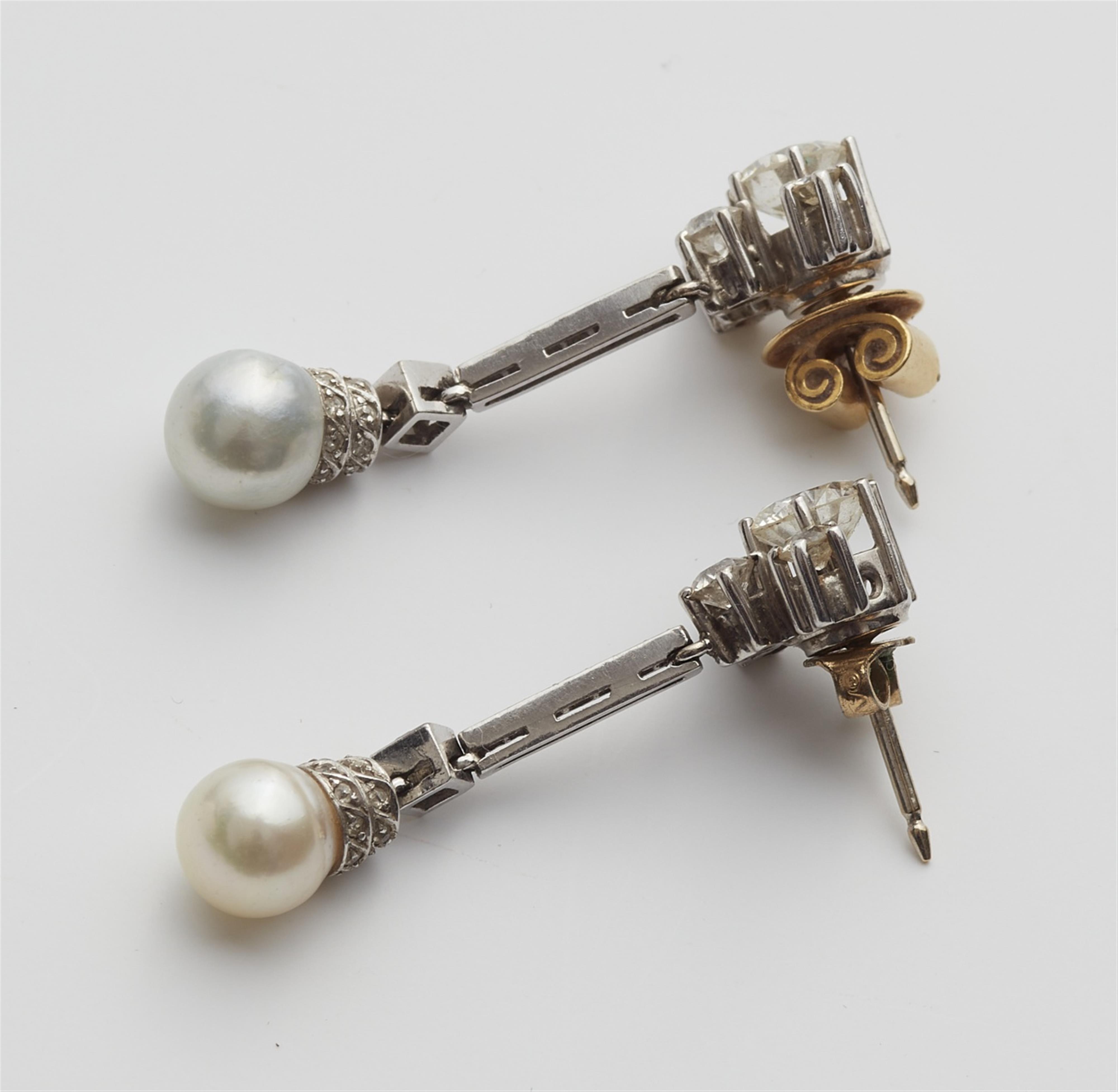 A pair of platinum diamond and pearl earrings - image-2