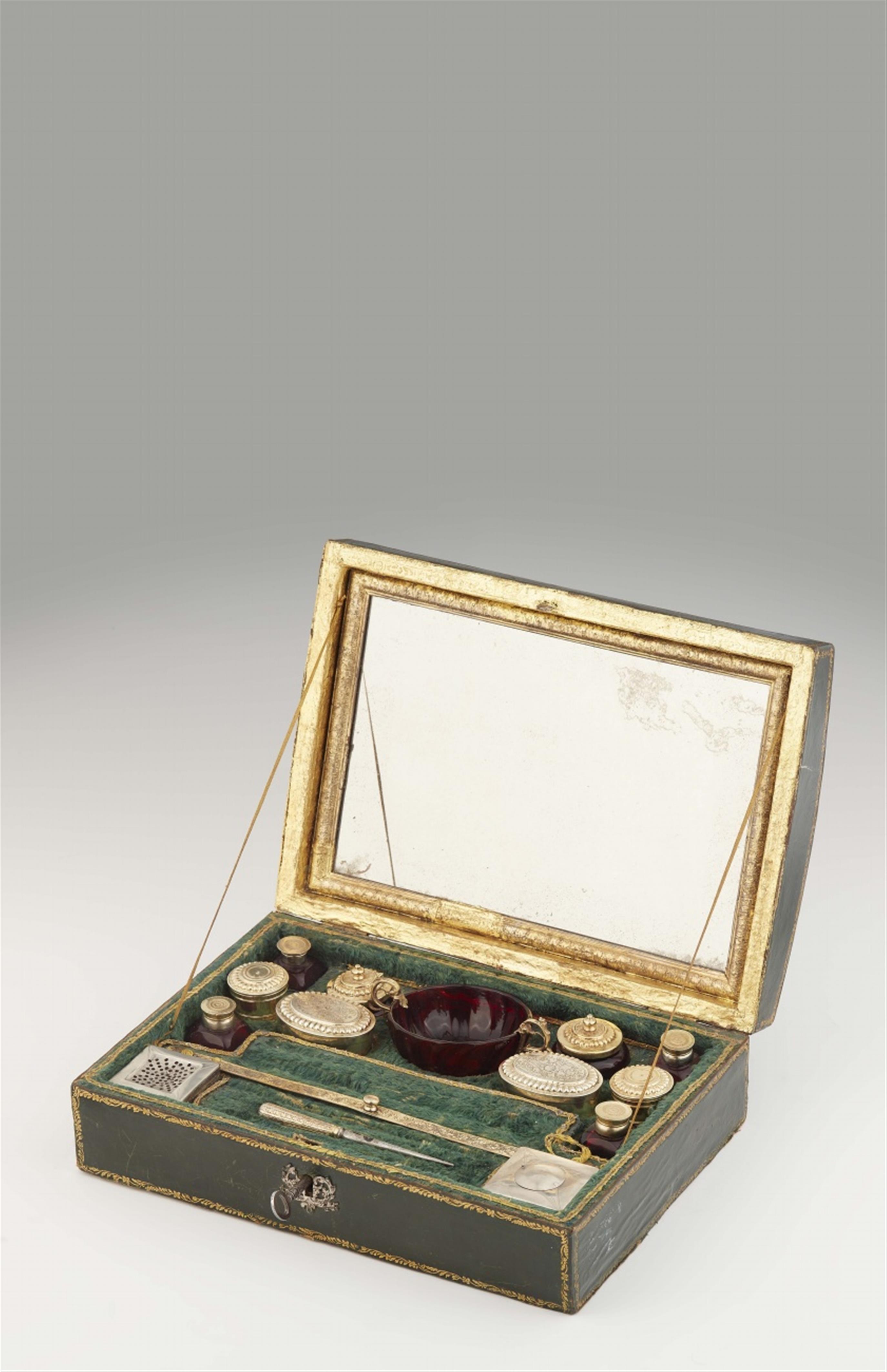 A silver gilt and ruby glass toilette set in its original casket - image-1