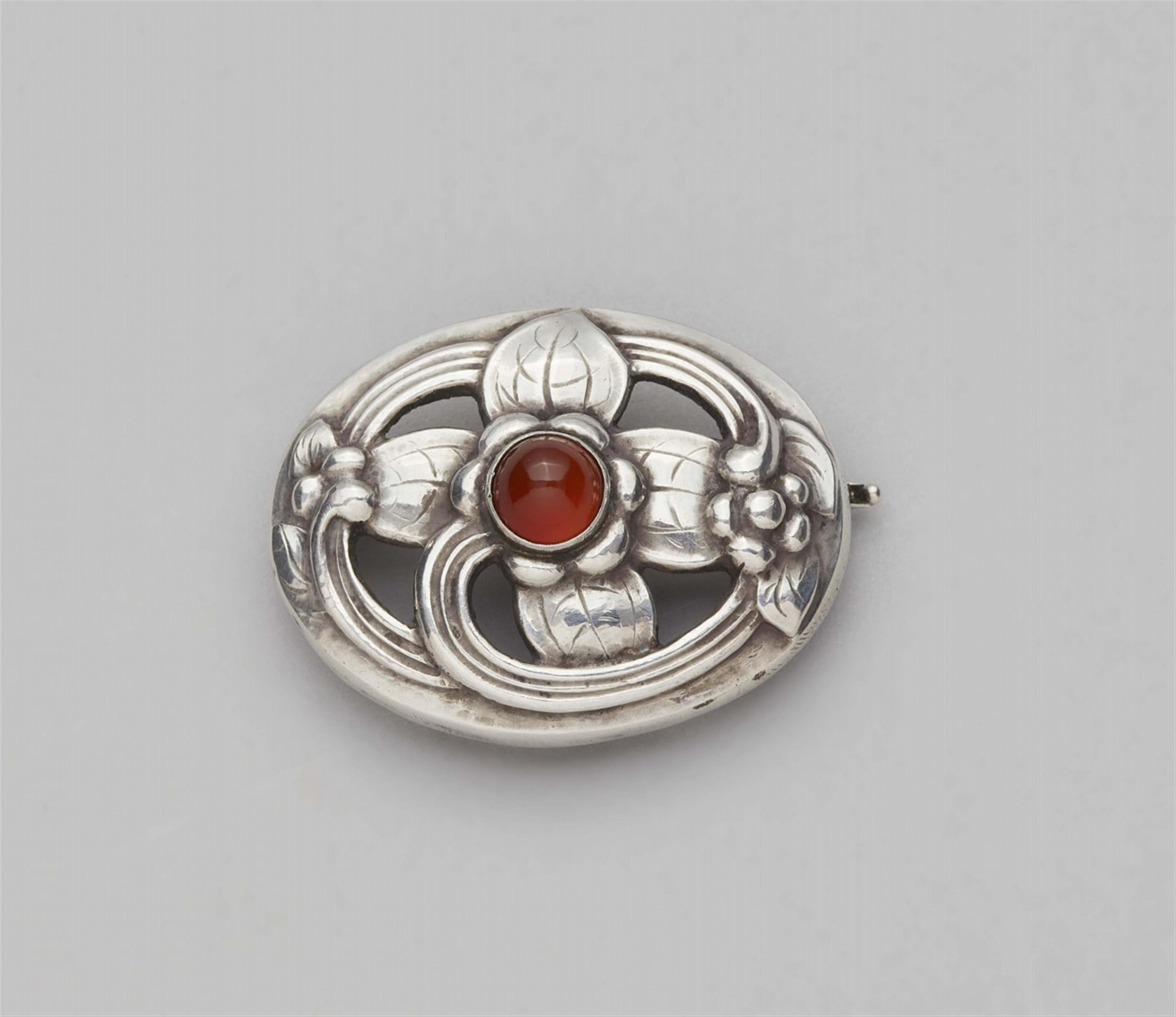 A Jugendstil Copenhagen silver brooch by Georg Jensen, model no. 138 - image-1