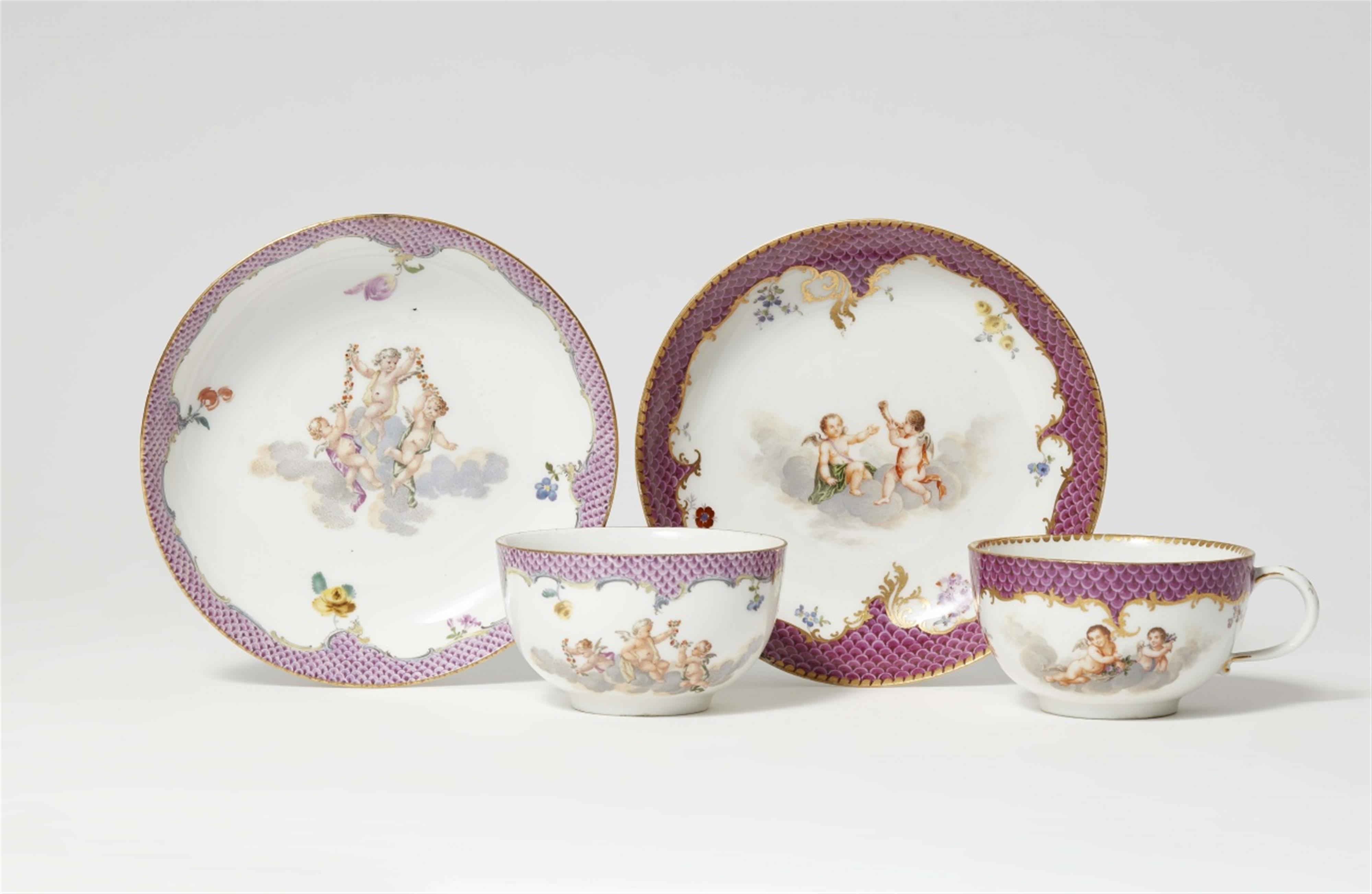Two Meissen porcelain cups and saucers with putto motifs - image-1