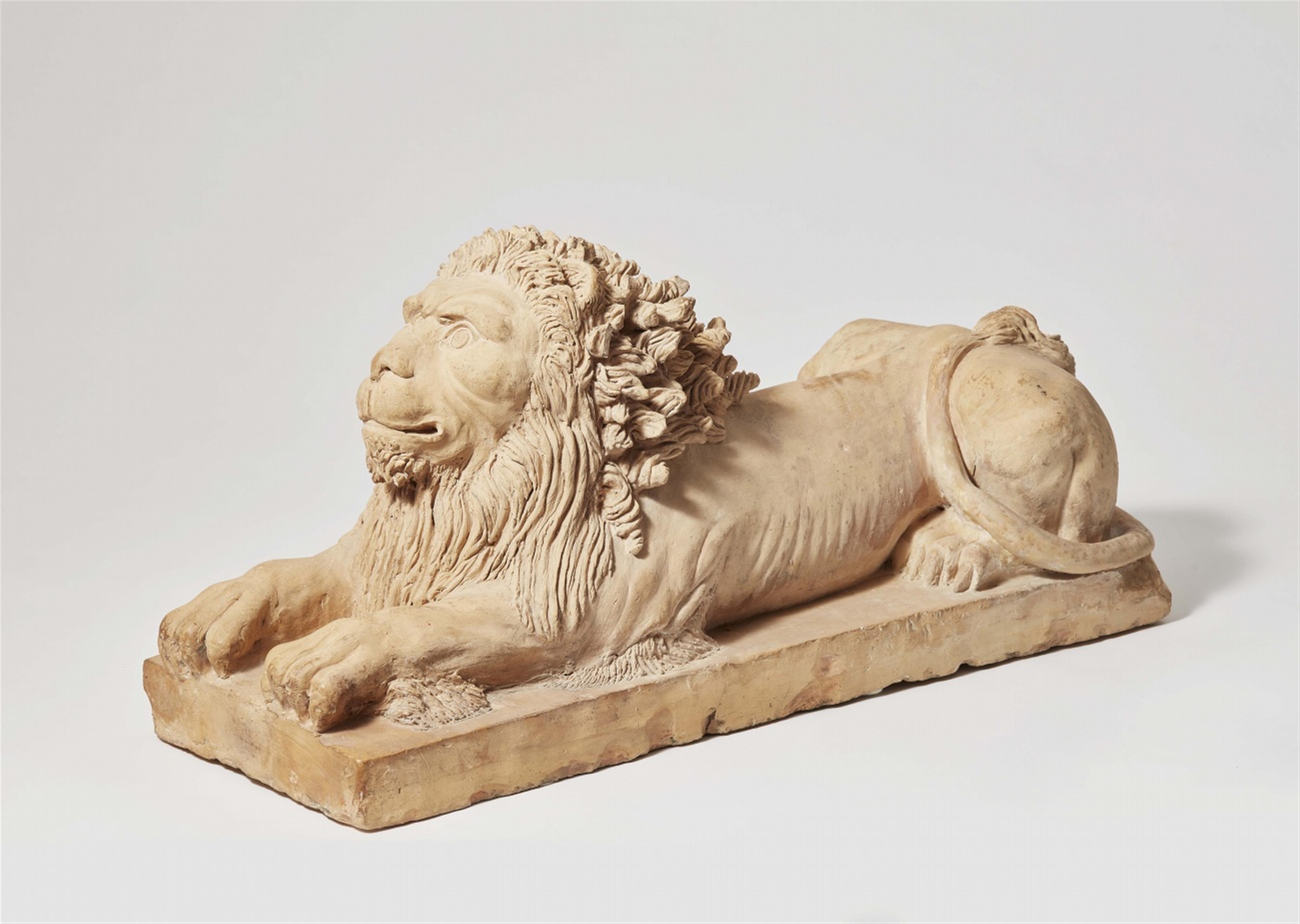 A terracotta model of a recumbent lion - image-1