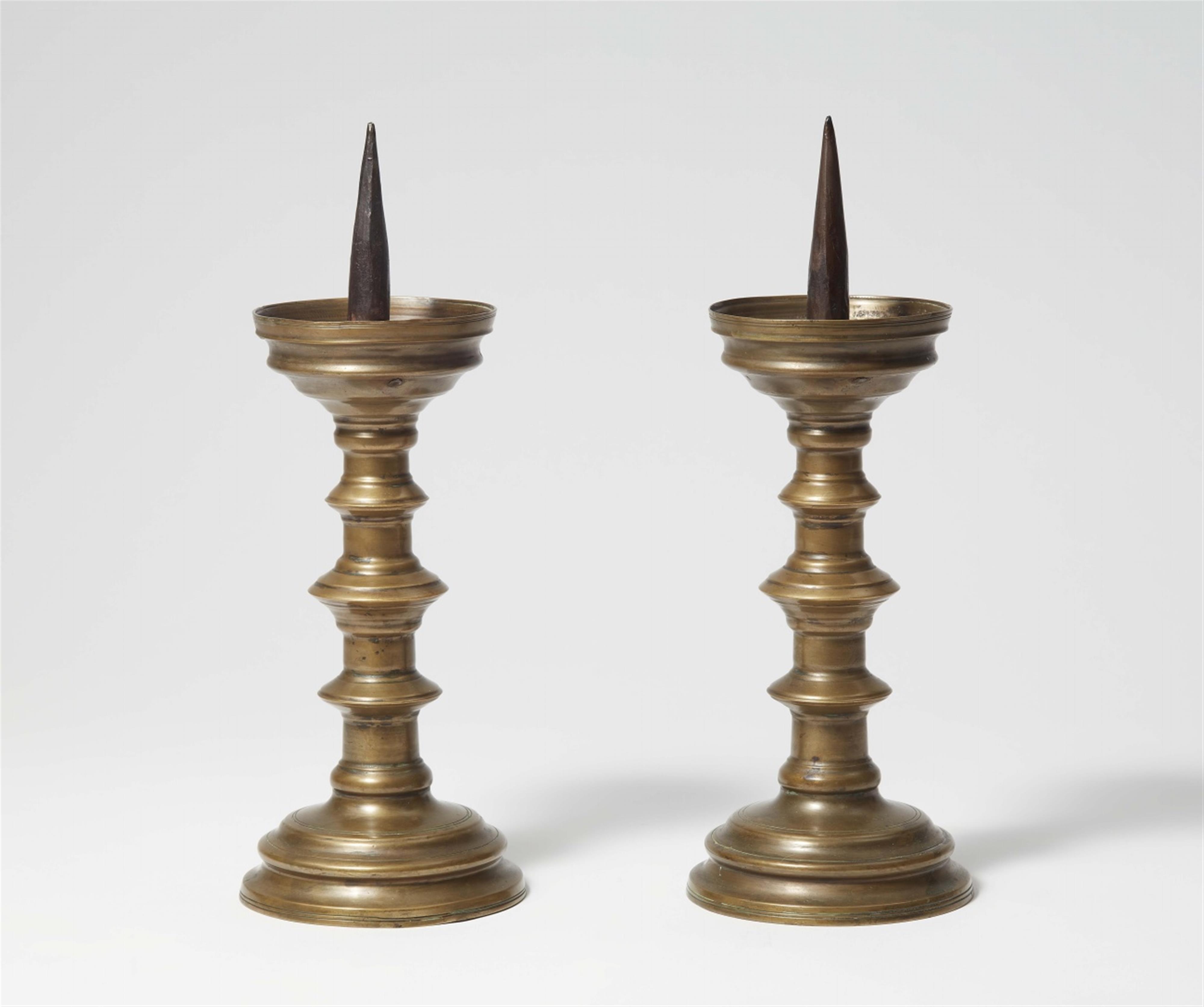 A pair of German late Gothic brass candlesticks - image-1