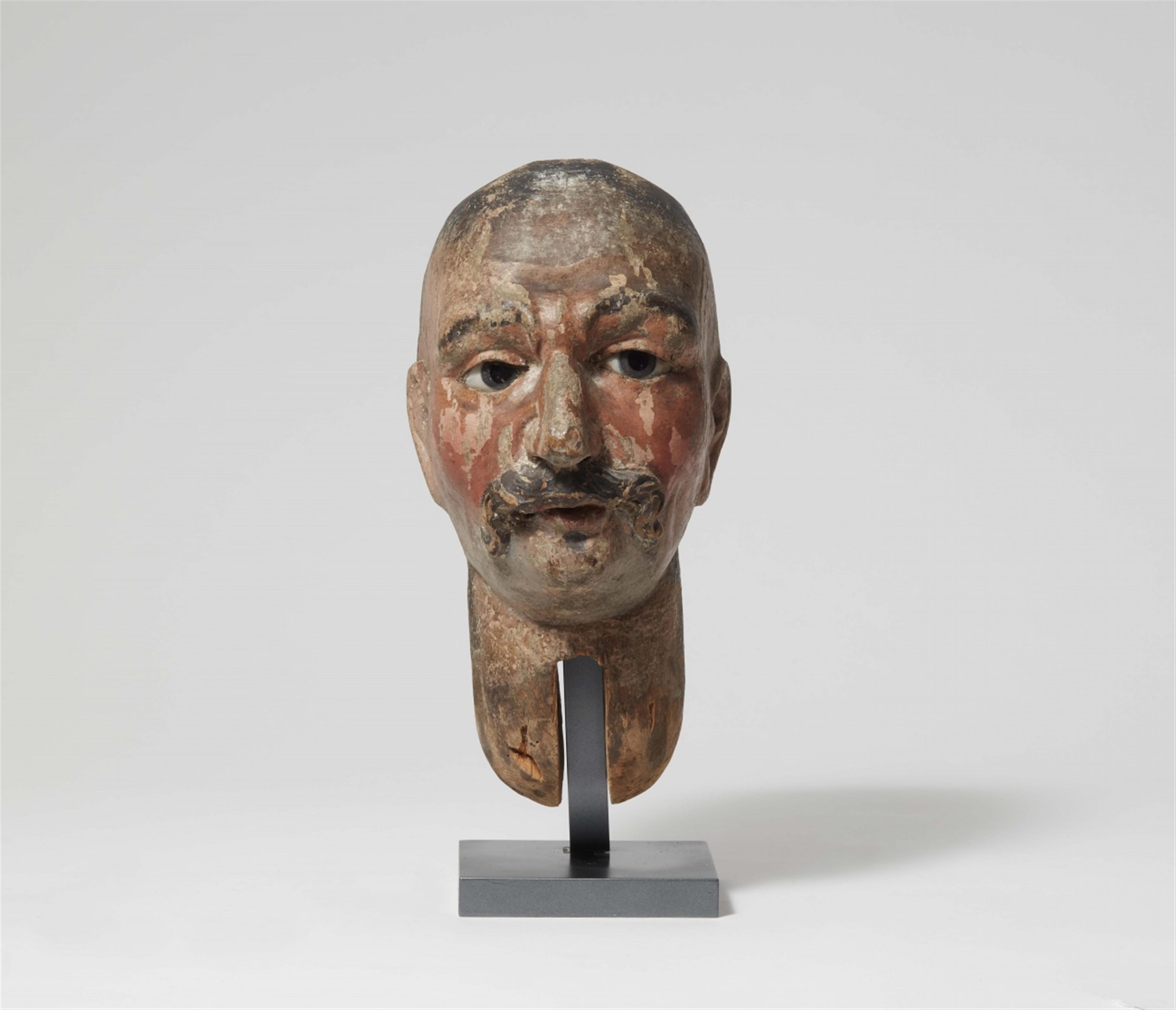 An carved softwood head of Suleiman - image-1