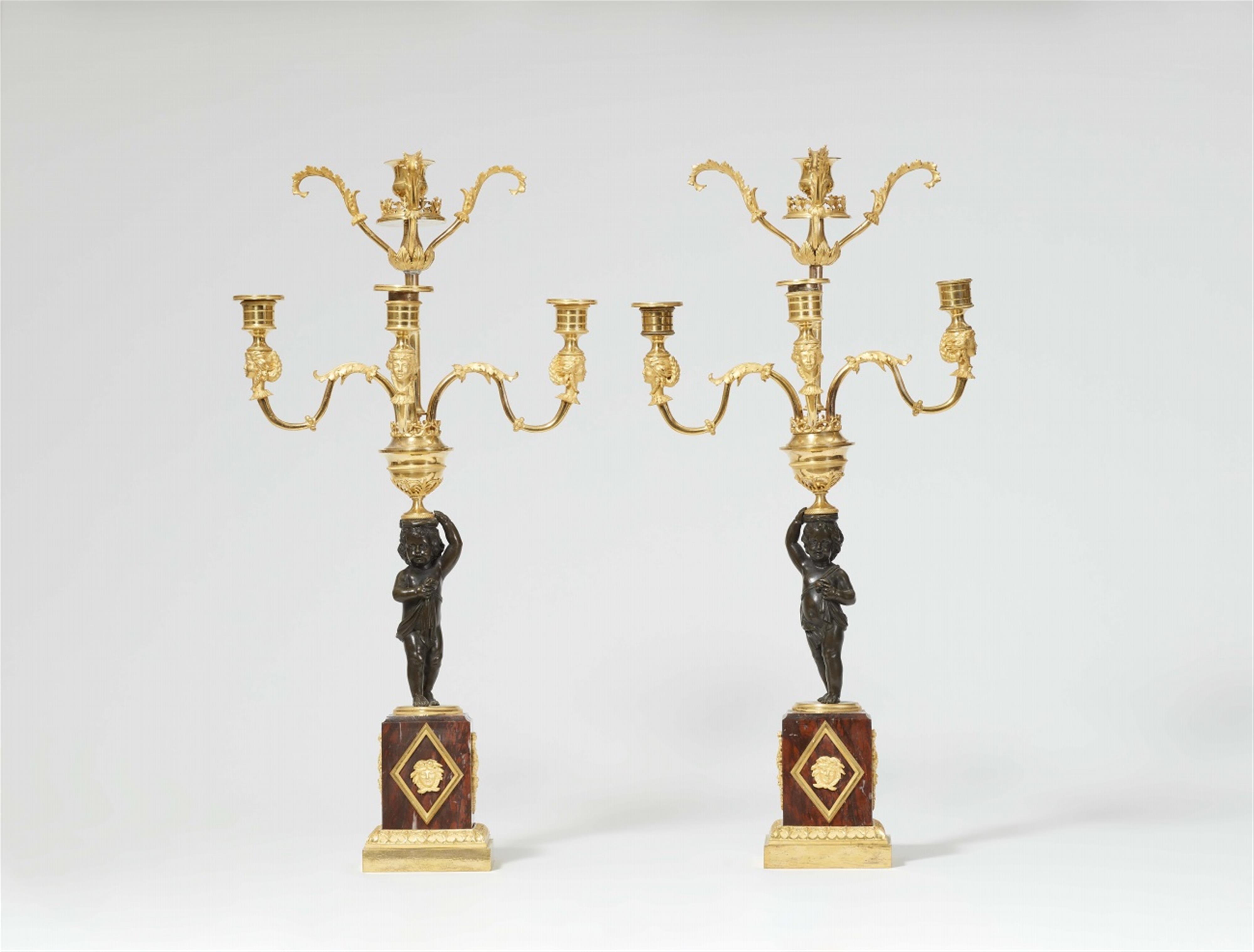 A pair of Louis XVI style ormolu candelabra - image-1