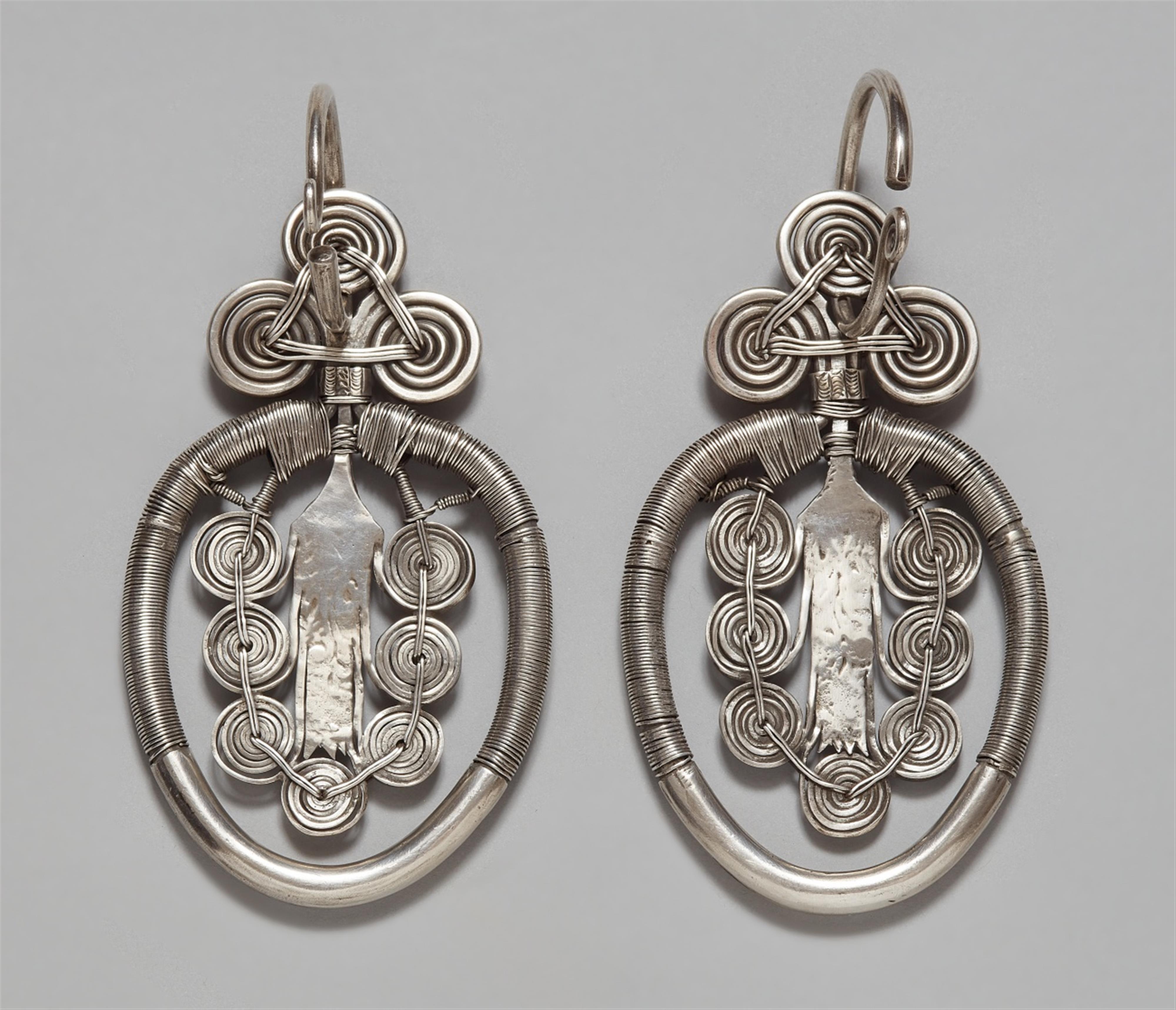 A pair of silver ear ornament of the Yao tribe. Southern China, Guangxi province, Jinxiu district. 1950s/1960s - image-1