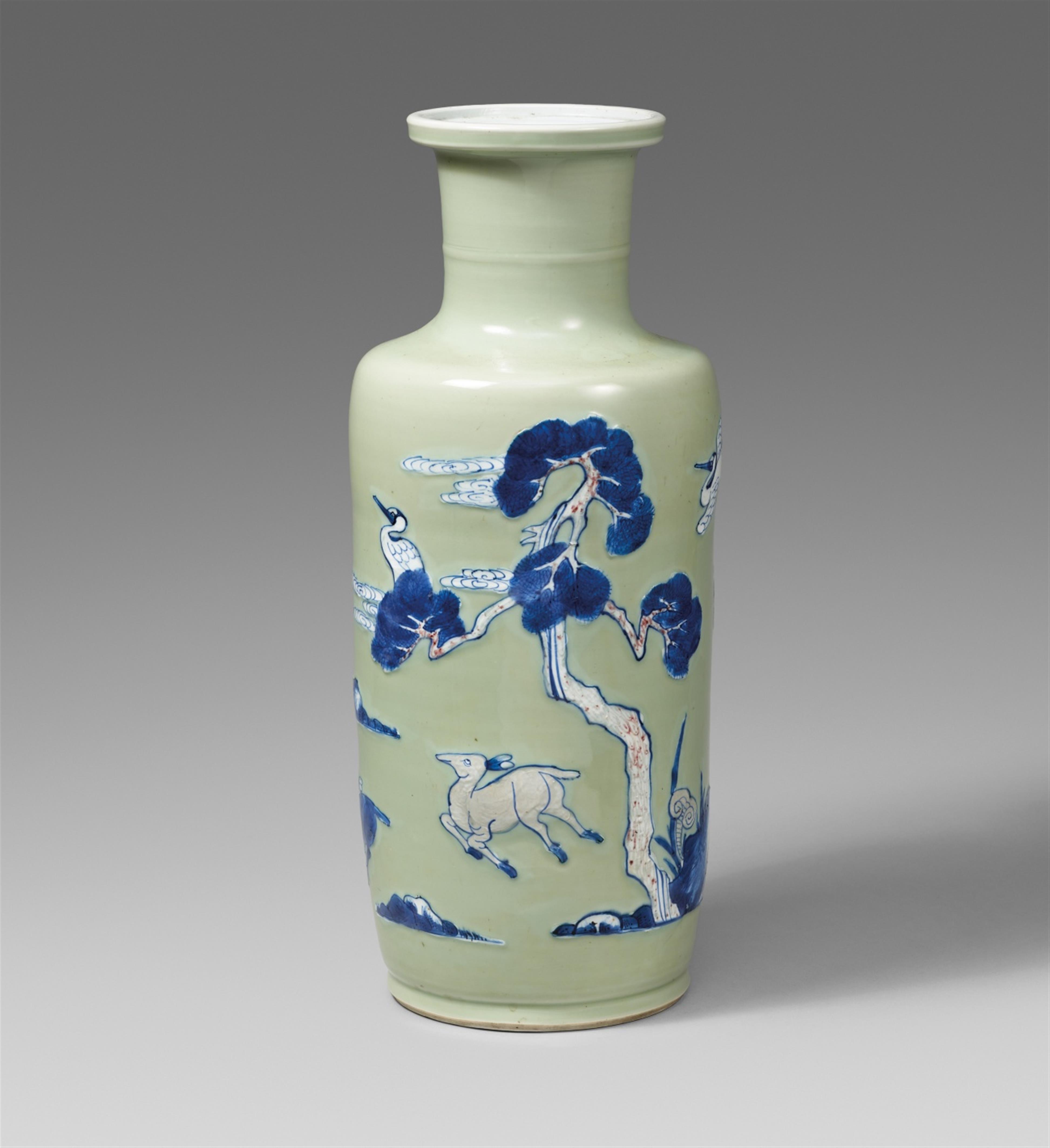 A blue and white, underglaze copper-red and white-slip-decorated celadon-ground rouleau vase. Kangxi period (1662-1722) - image-1