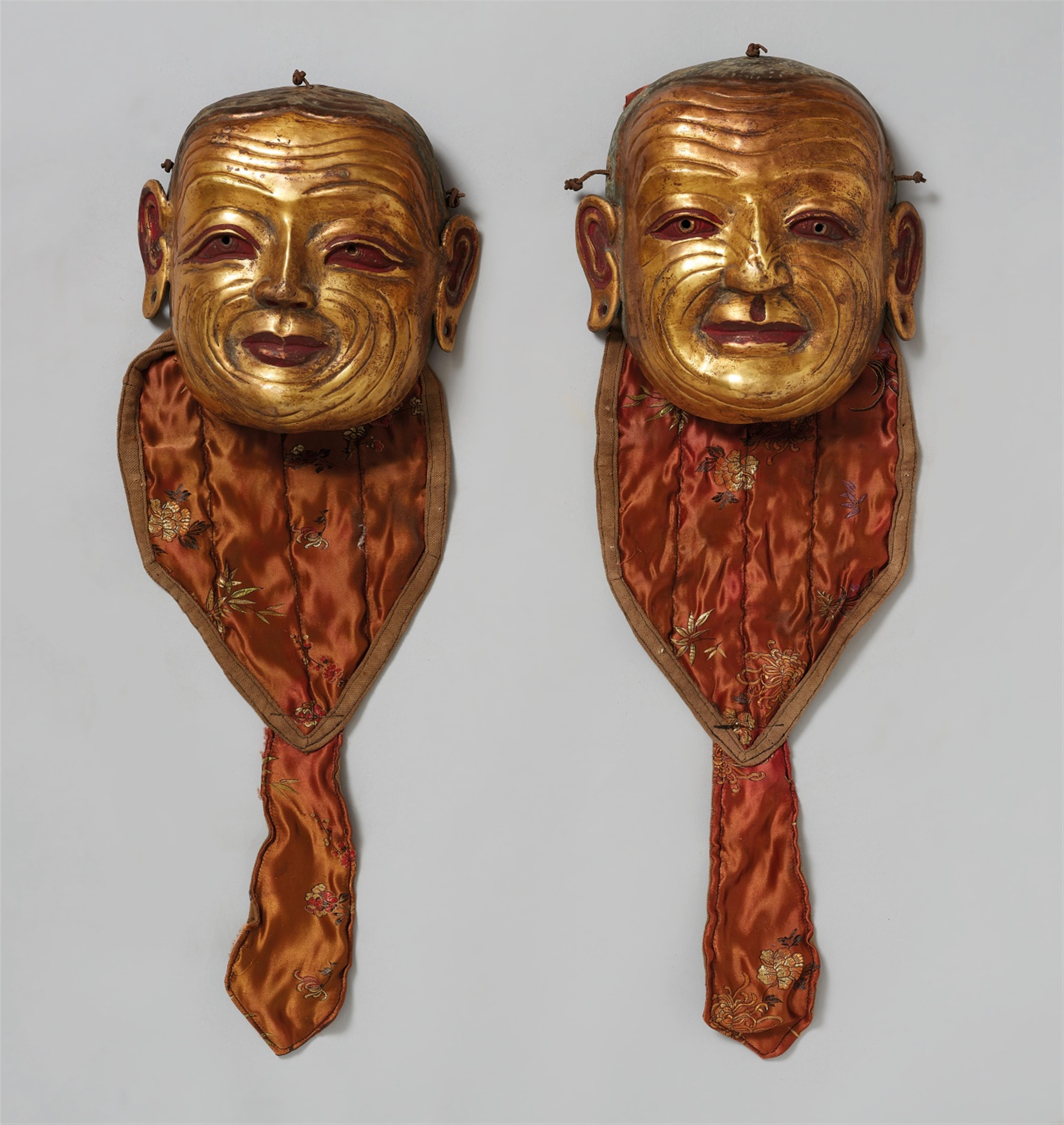 A pair of Tibetan gilt bronze ritual dance masks - image-1