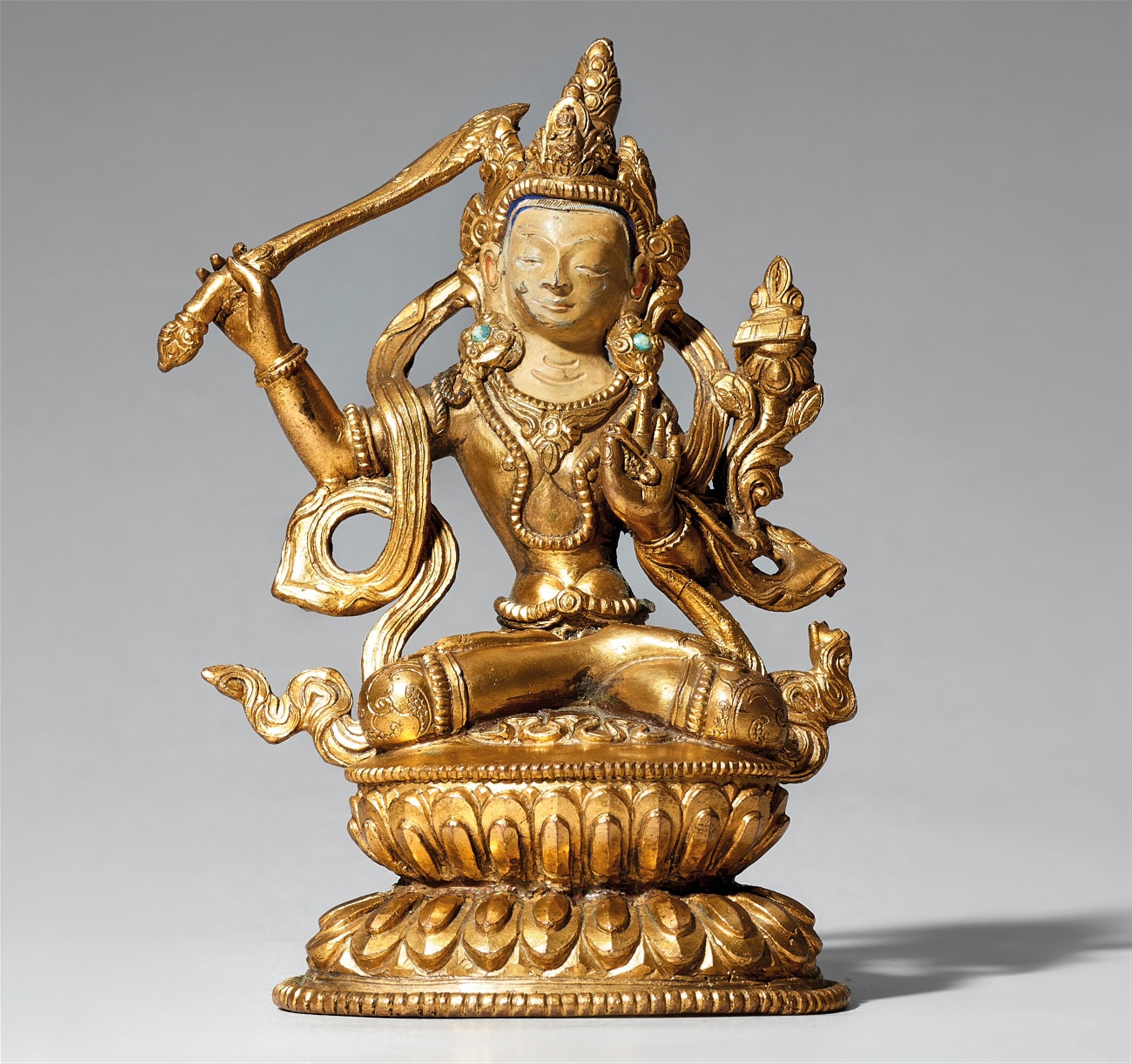 A Tibetan gilt bronze figure of Manjushri. Late 19th/early 20th century - image-1